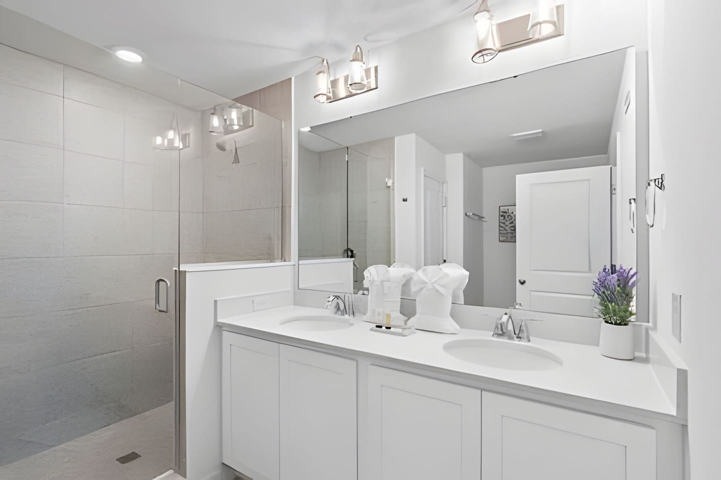 Elegant Master Bathroom, with dual sinks, a walk-in shower, and elegant finishes. 