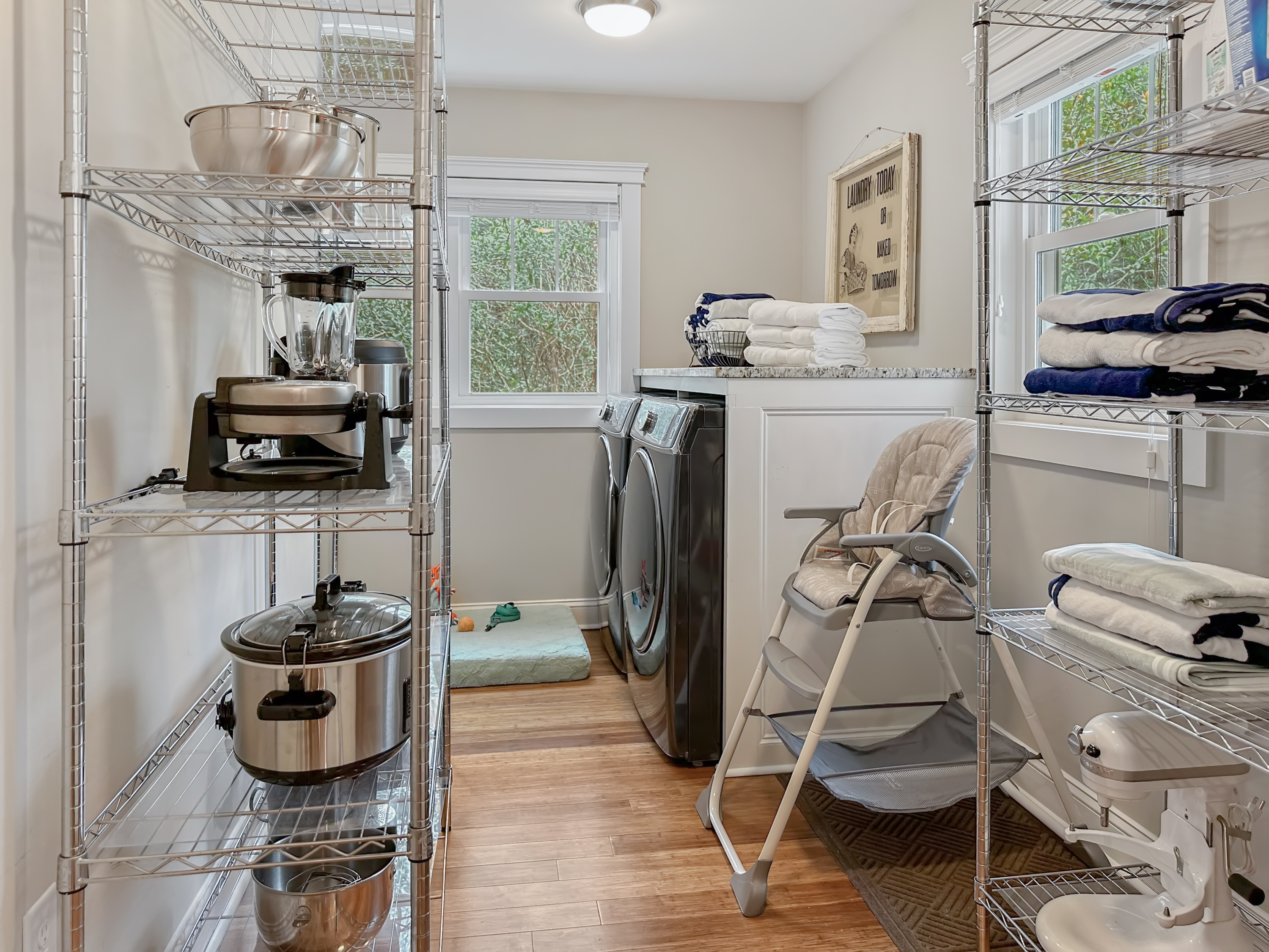 Off the Kitchen is the Laundry / Pantry Room, where you'll find extra appliances, a high chair...