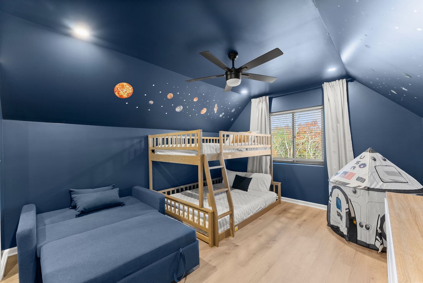 a full-over-queen bunk and a cozy sleeper chair