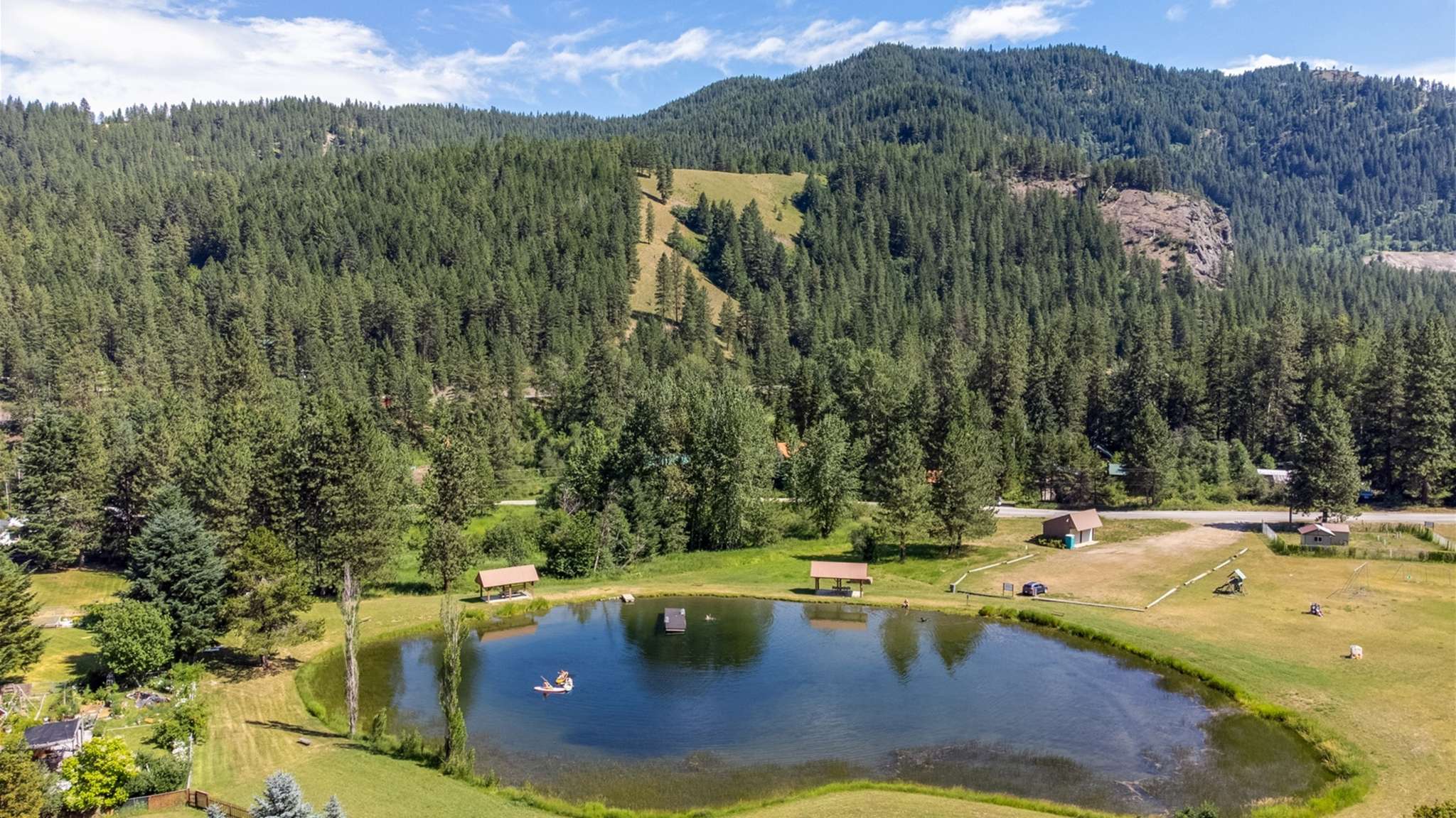 Community pond and floating docks for summer swimming and picnics.