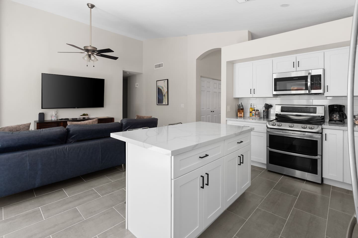 The living room is spacious, comfortable and a great place for everyone to gather.