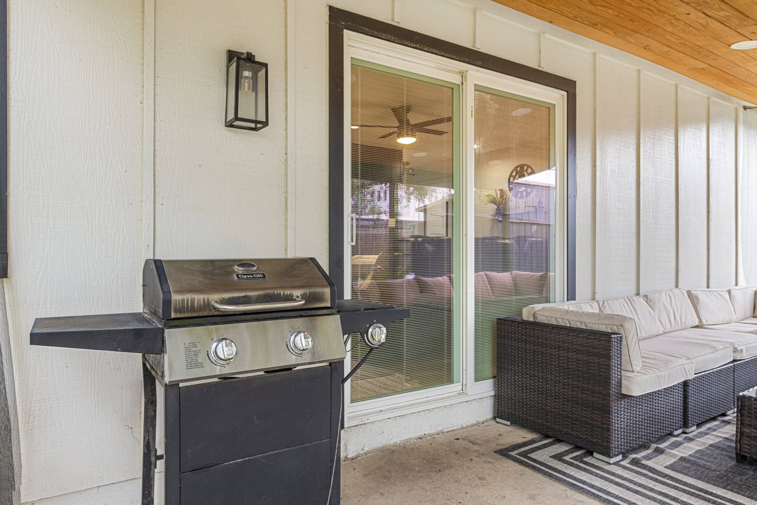 Unwind on the patio with a grill and stylish seating for epic gatherings!