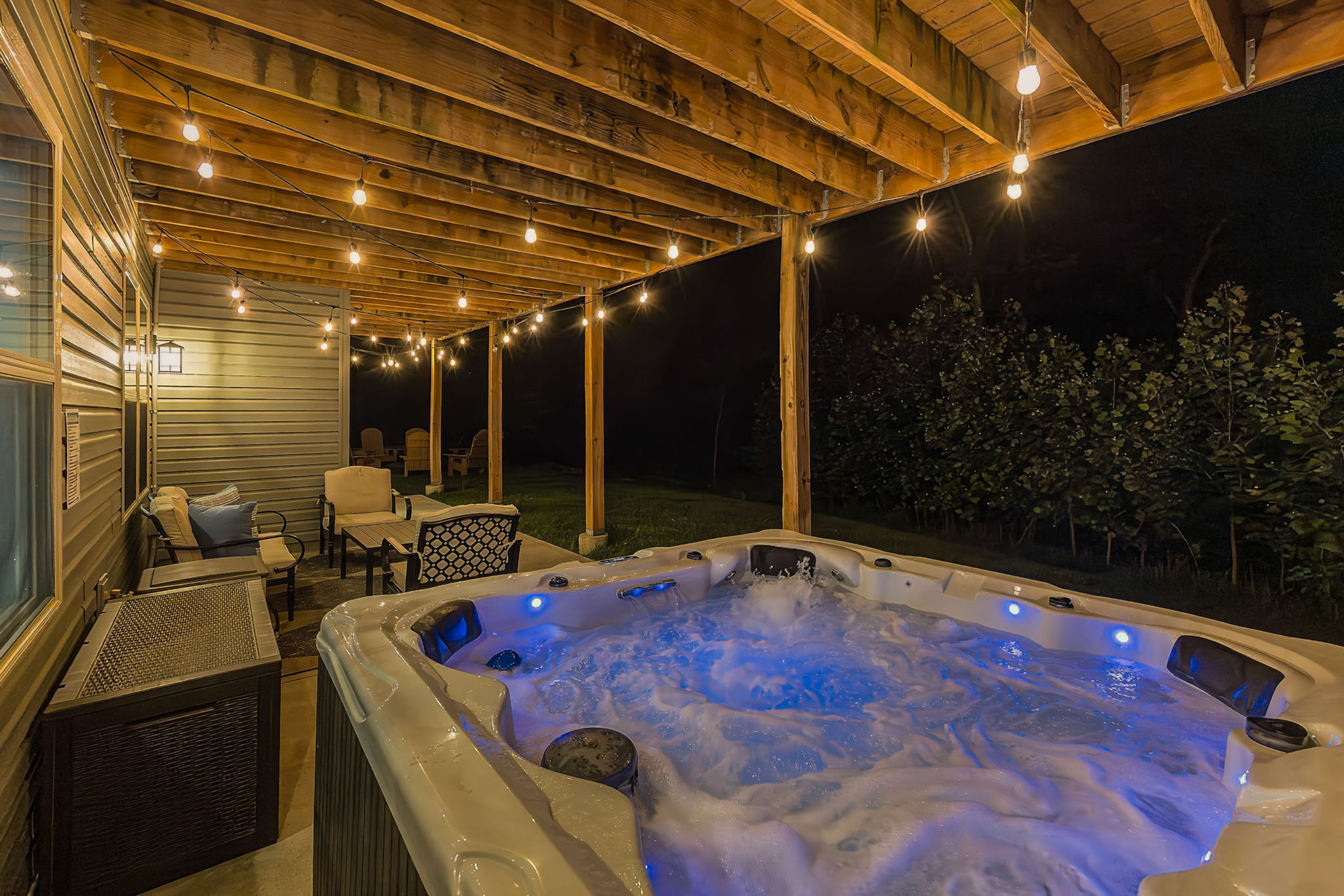 String lights create the perfect atmosphere for an evening soak.