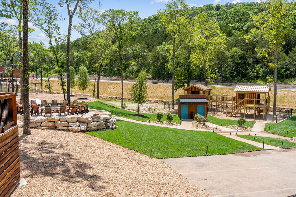 Stroll to the lakeside dock and open lawn ,  room to fish, picnic, and play at Tall Timbers.