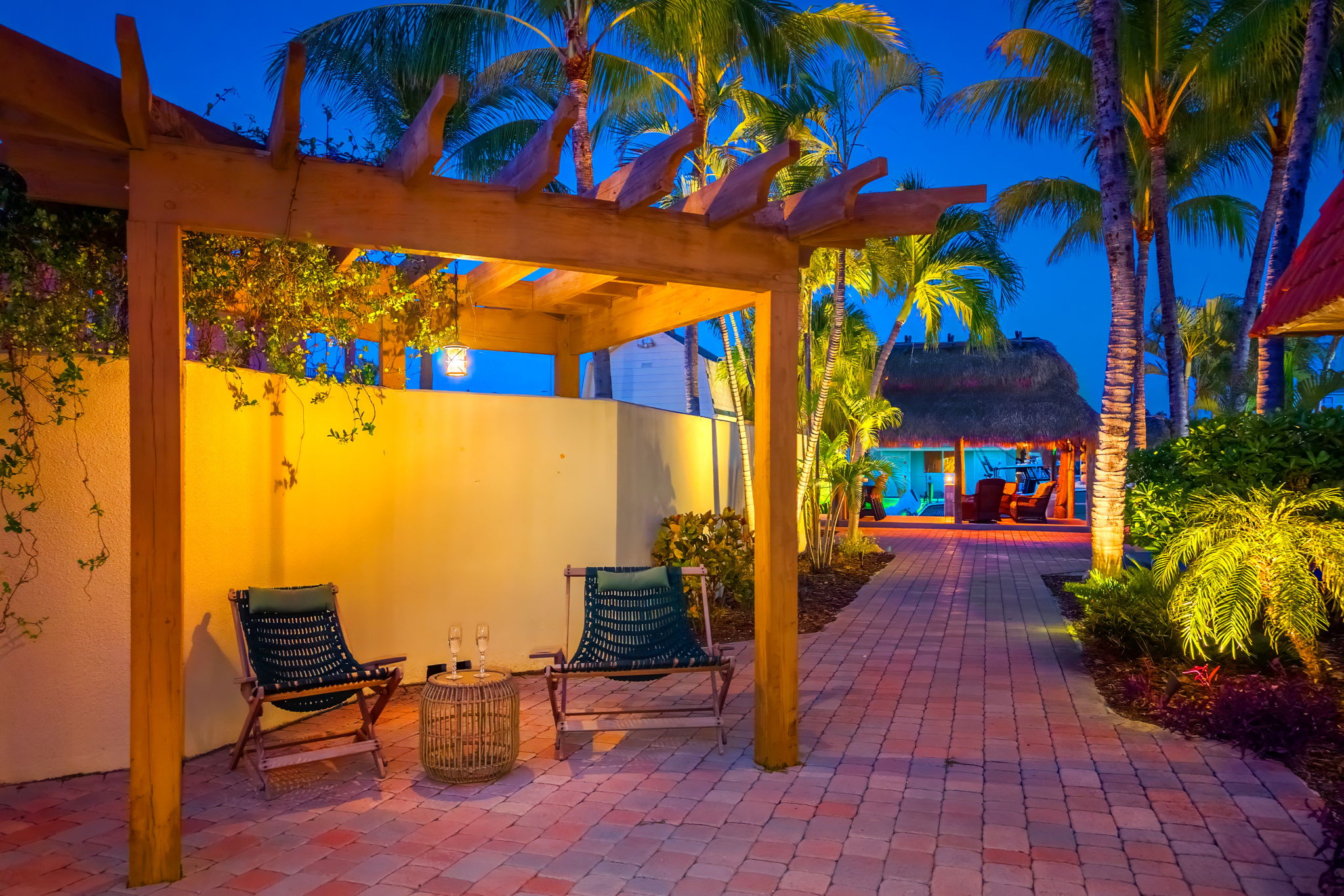 Site lighting make the backyard a magical place at night.