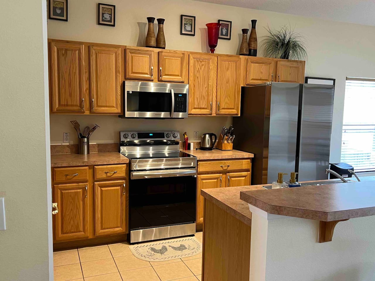 Recently updated appliances in kitchen, overlooking Living Room 2 with a Smart TV 