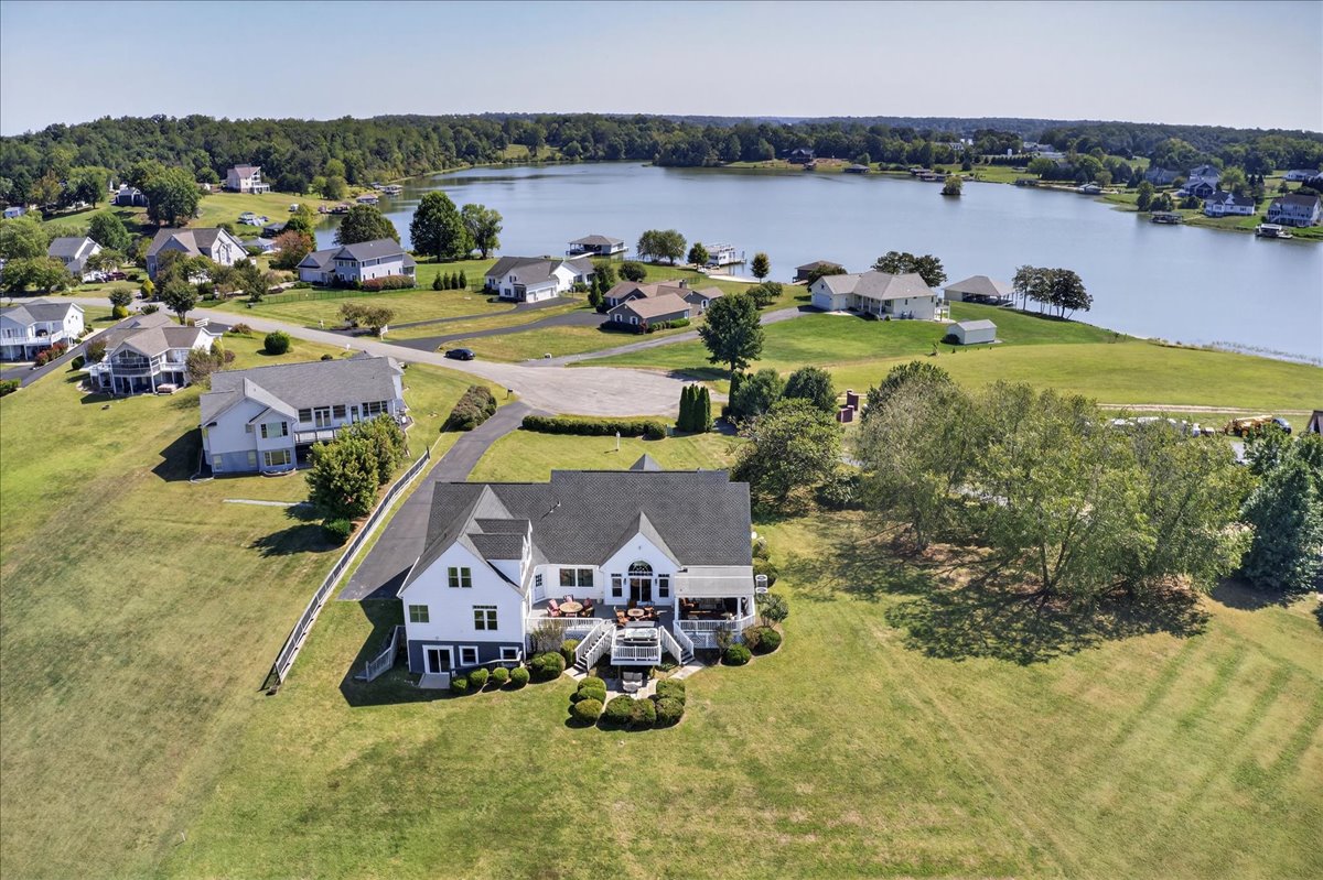 The perfect setting: open yard, private waterfront, and wide lake views.