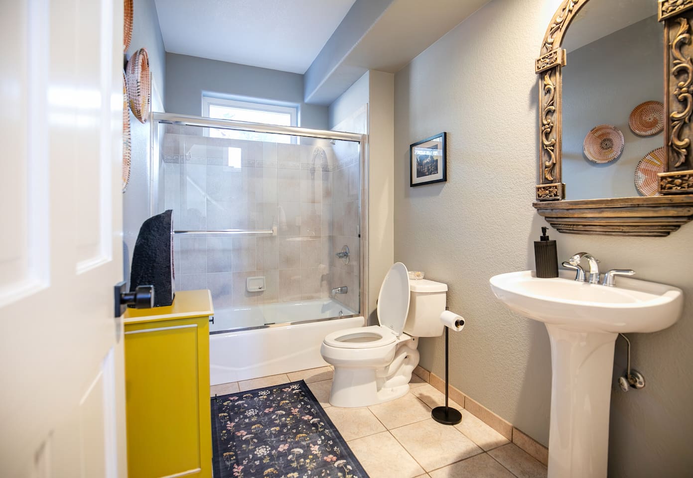 Our full bathroom on the main level is complete with soft towels, shower and tub.
