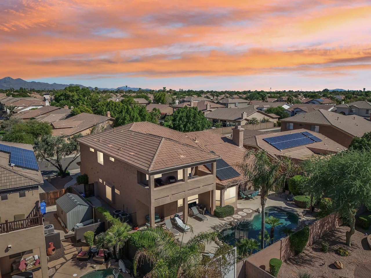This elevated view shows the full outdoor living experience—from pool to patio—all glowing under Scottsdale’s vibrant skies.