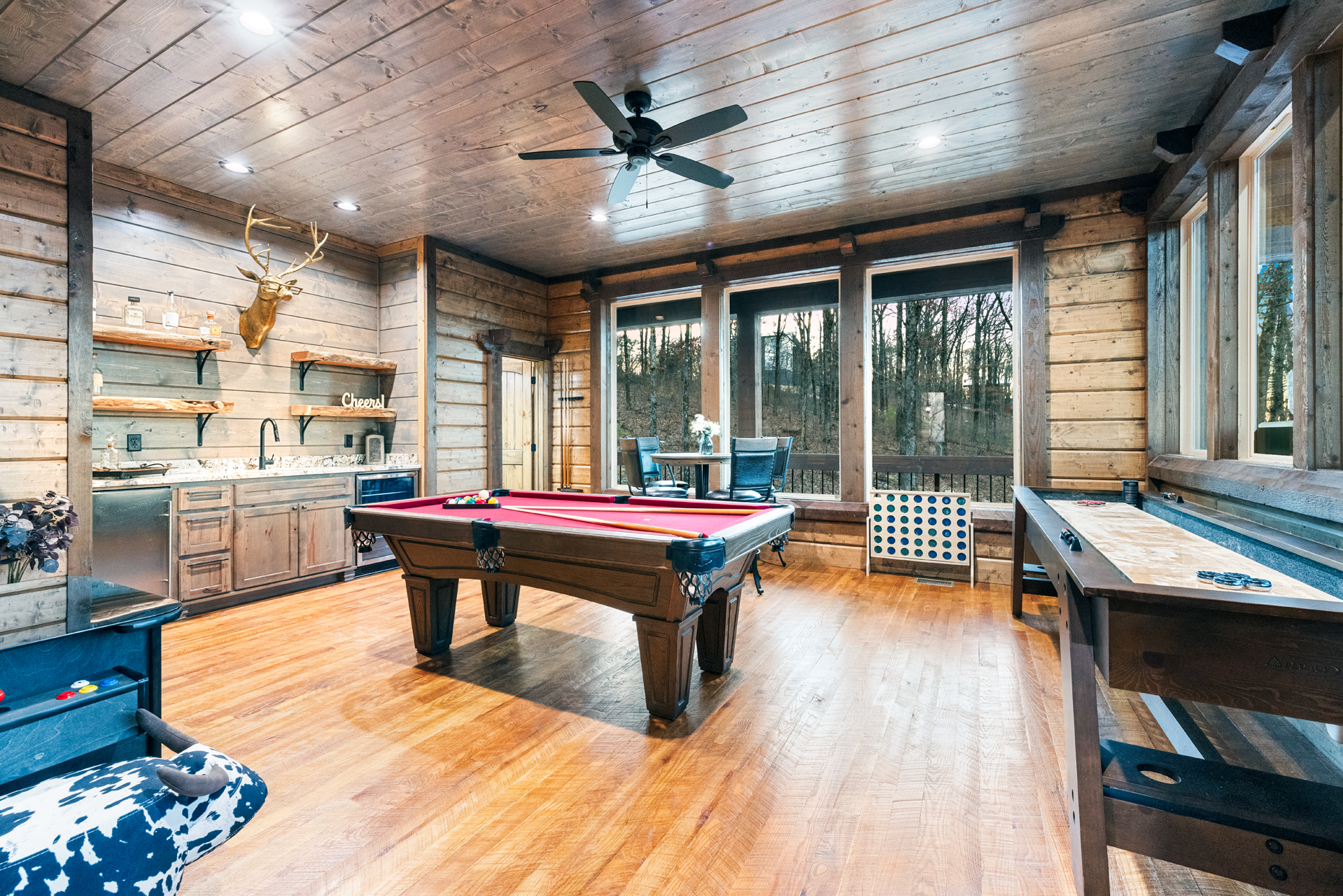 Spacious game room featuring pool, shuffleboard, and endless entertainment