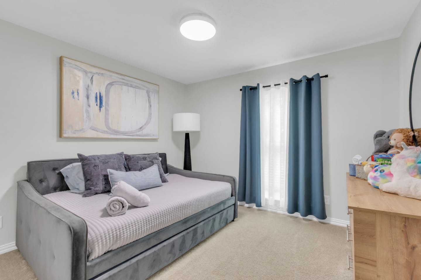 Guest bedroom with trundle bed and black out curtains