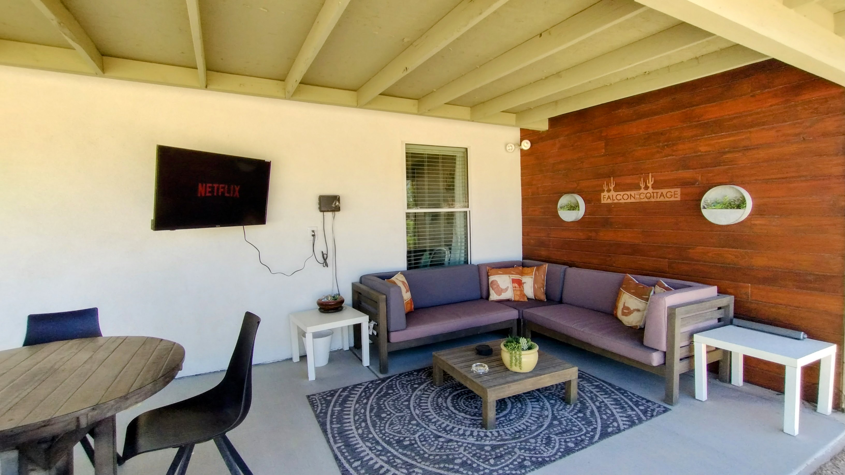 Outdoor seating area with relaxing sectional and smart TV. Perfectly set up for a relaxing evening grilling and spending time together. The TV mount can pivot to enjoy from either side of the patio