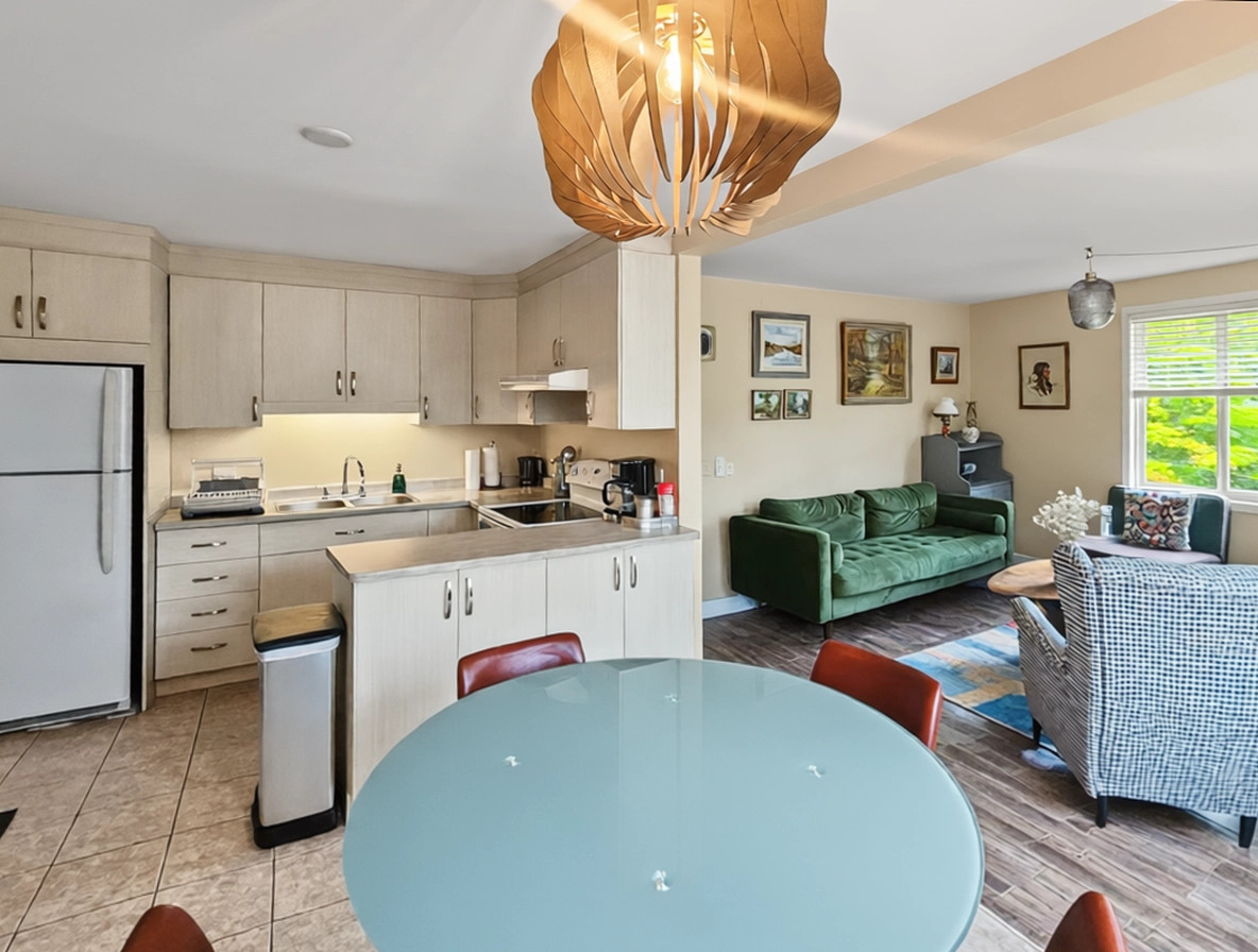 Dining area with views of kitchen and living room