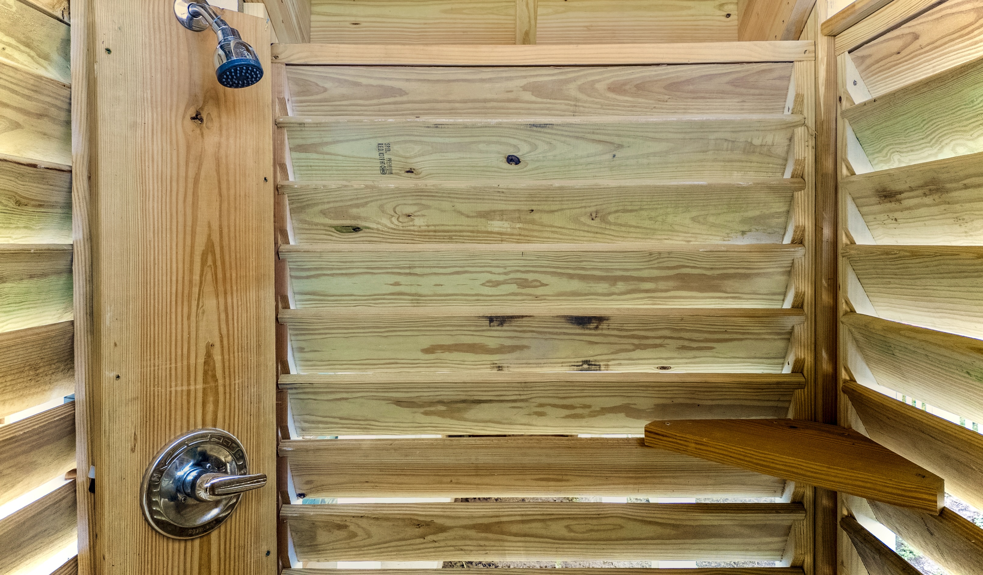 The outdoor shower is perfect to rinse off after the beach or before the pool. You'll love the hot and cold water!