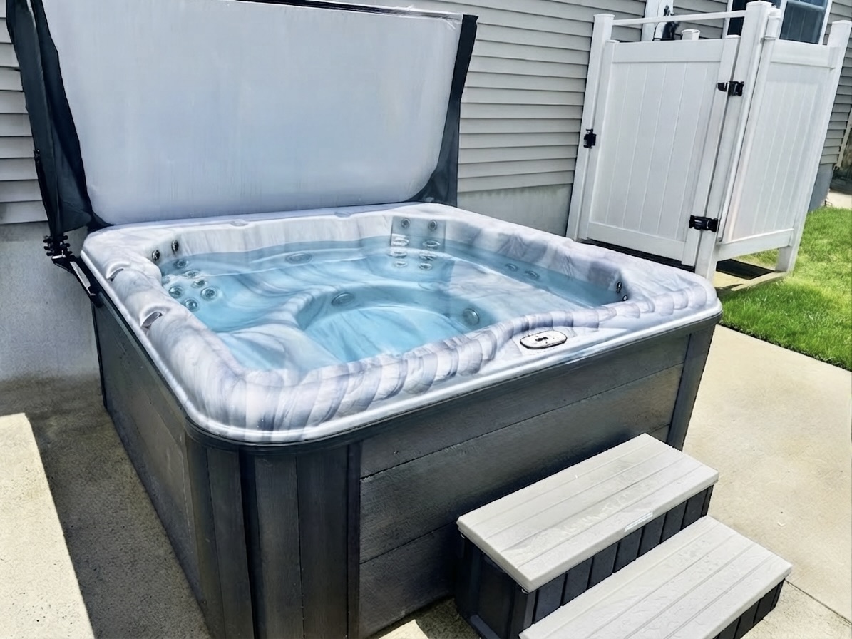 Enjoy a relaxing soak in the bubbling hot tub after a day of adventure. This private outdoor amenity features easy-step access and is situated right next to a convenient outdoor shower for a quick rinse before or after a dip.