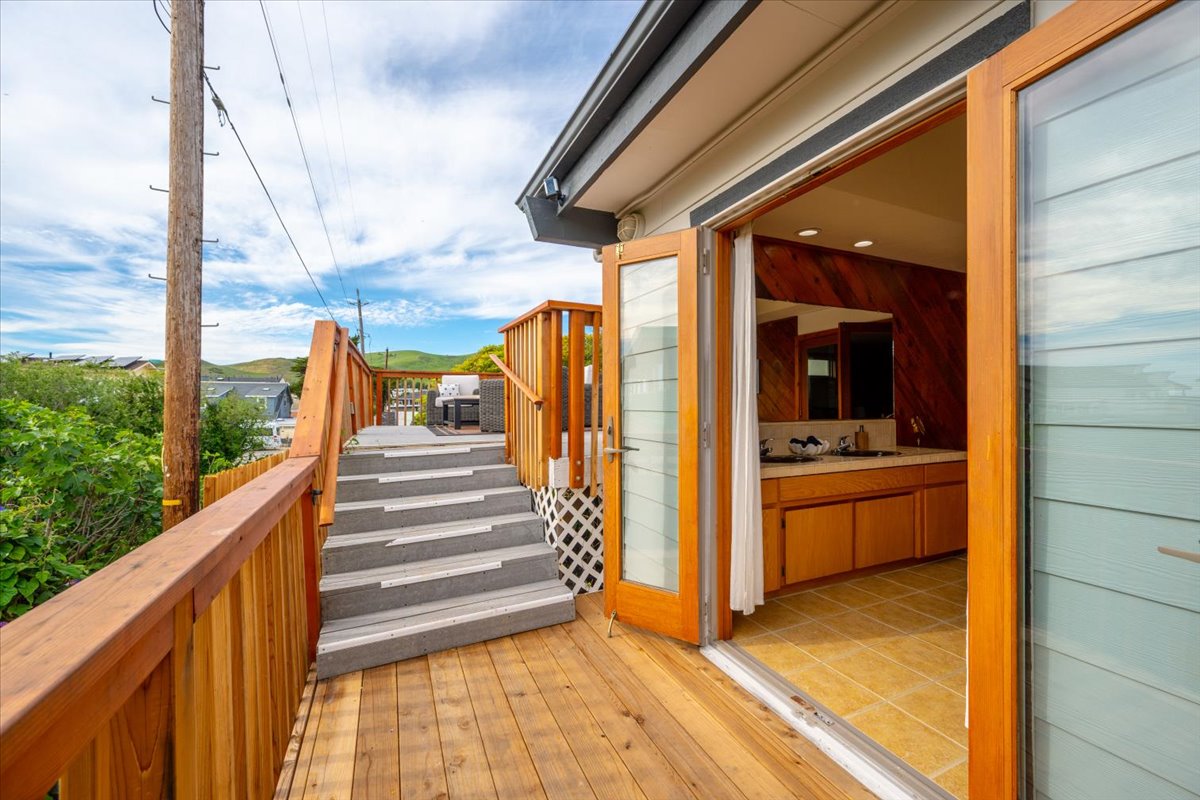 large open doors from primary ensuite to viewing deck.