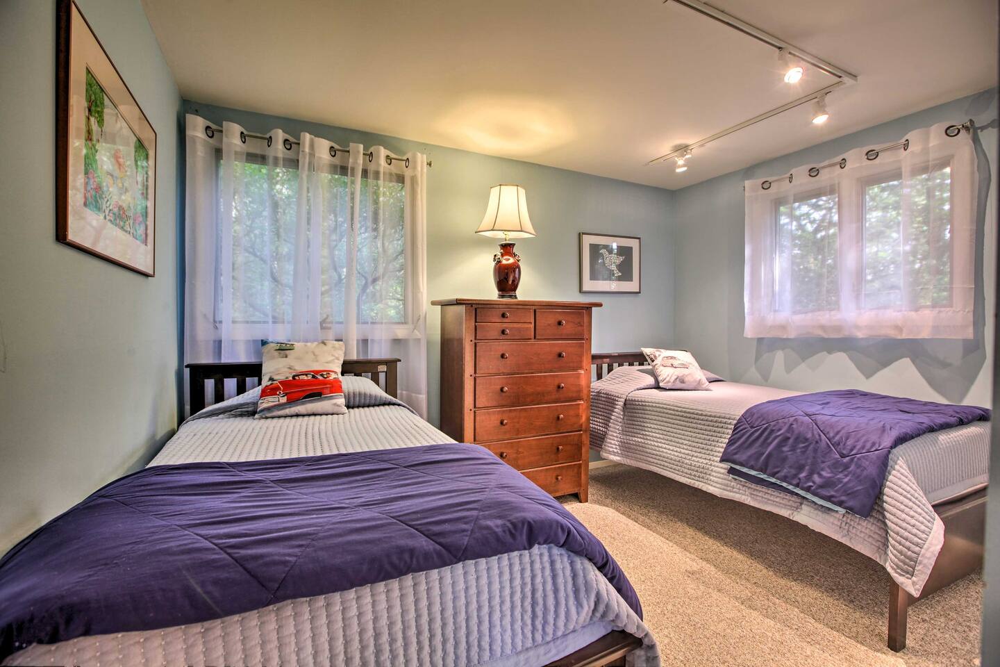 Sleep side-by-side in these 2 twin beds.
