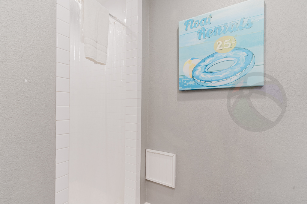 The restroom in this suite features a shower tiled floor to ceiling
