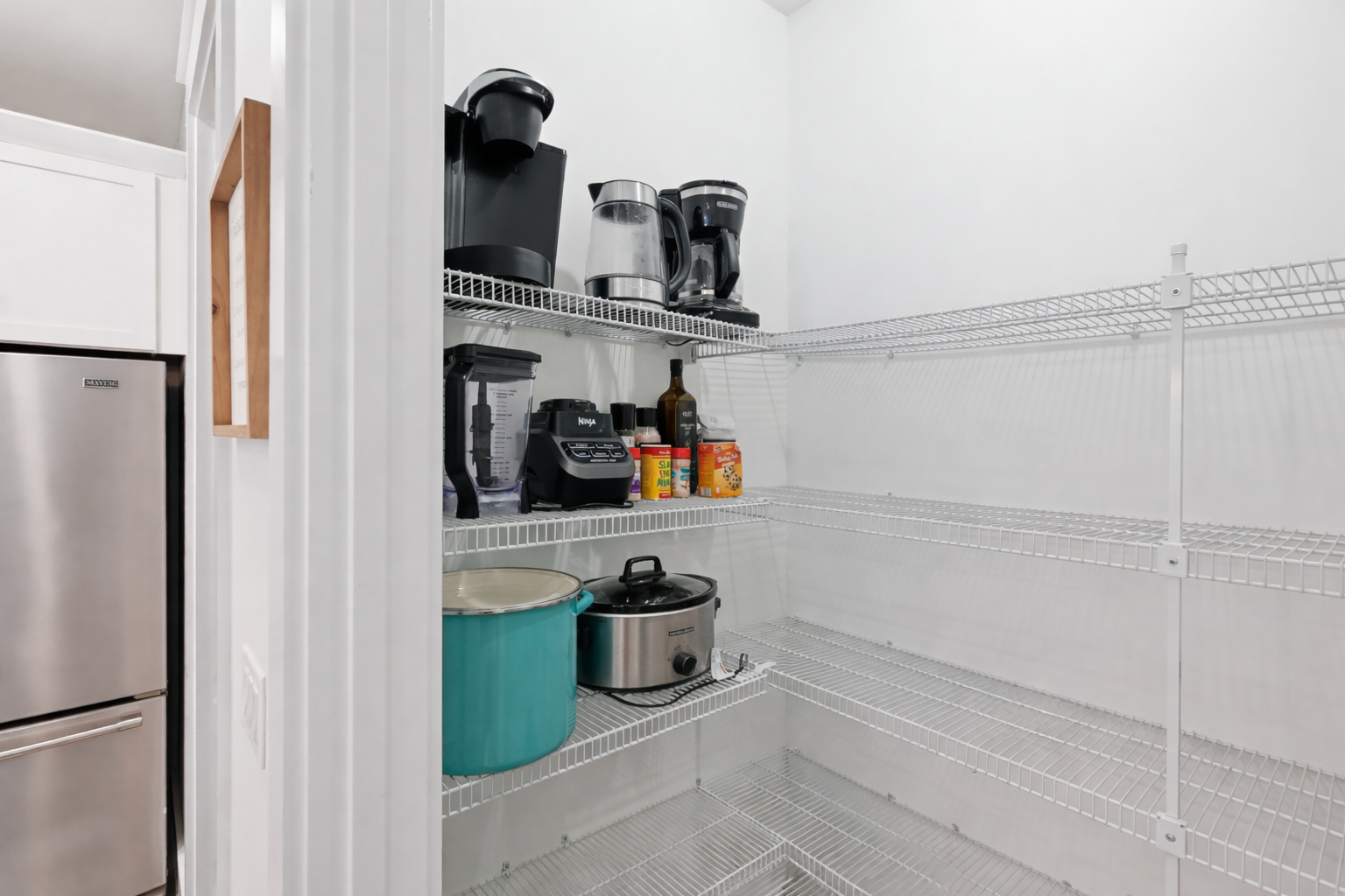 Pantry is stocked with additional appliances for your use.