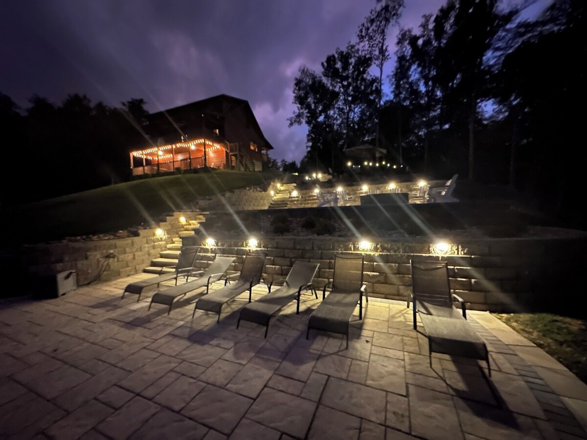 Patio lights are automatically turned on at night at dusk and on a timer located under the outdoor kitchen sink. 