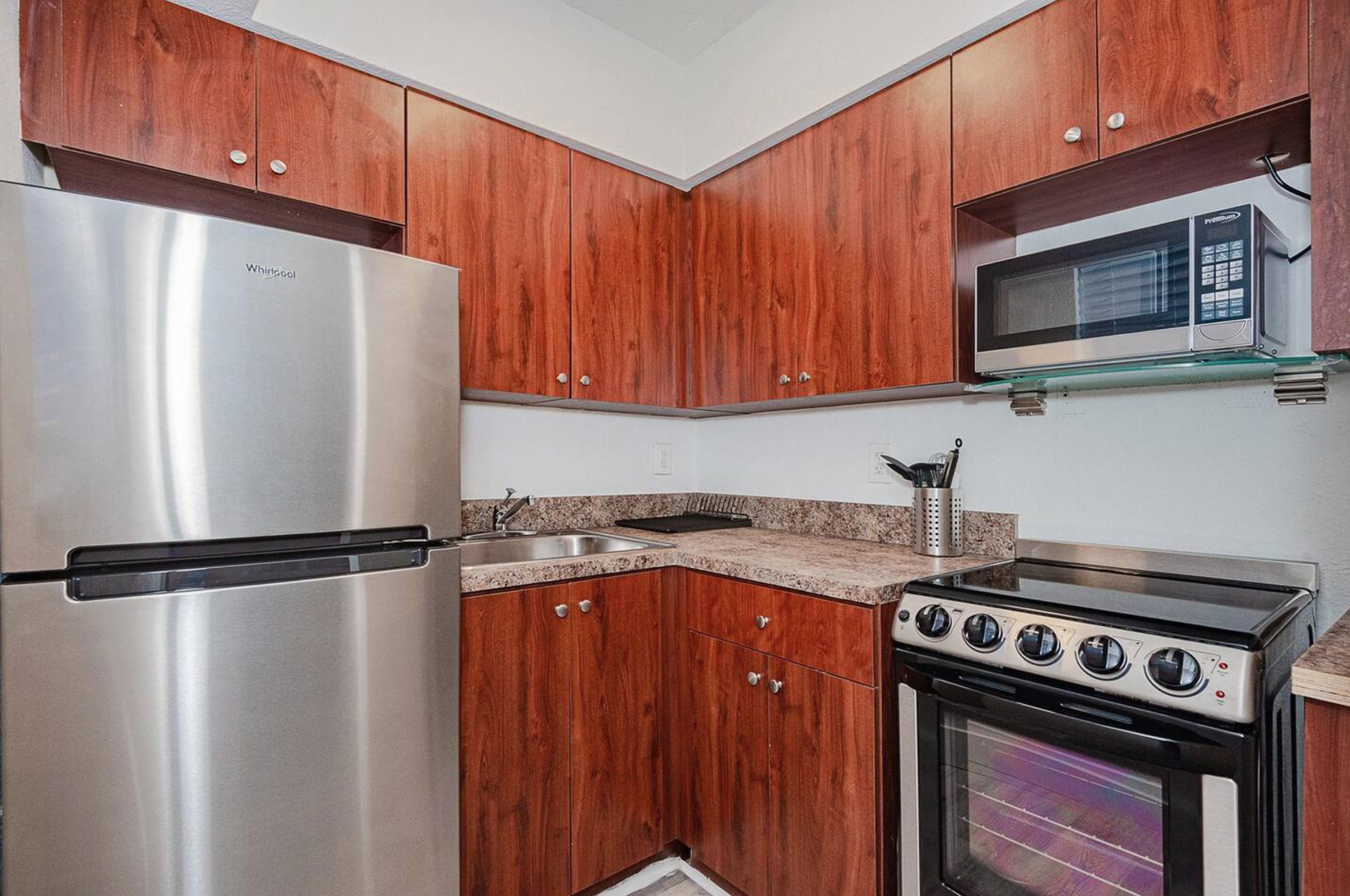 Fully stocked kitchen with stainless steel appliances. 2m video tour link sent after booking includes all open cabinets to show supplies.