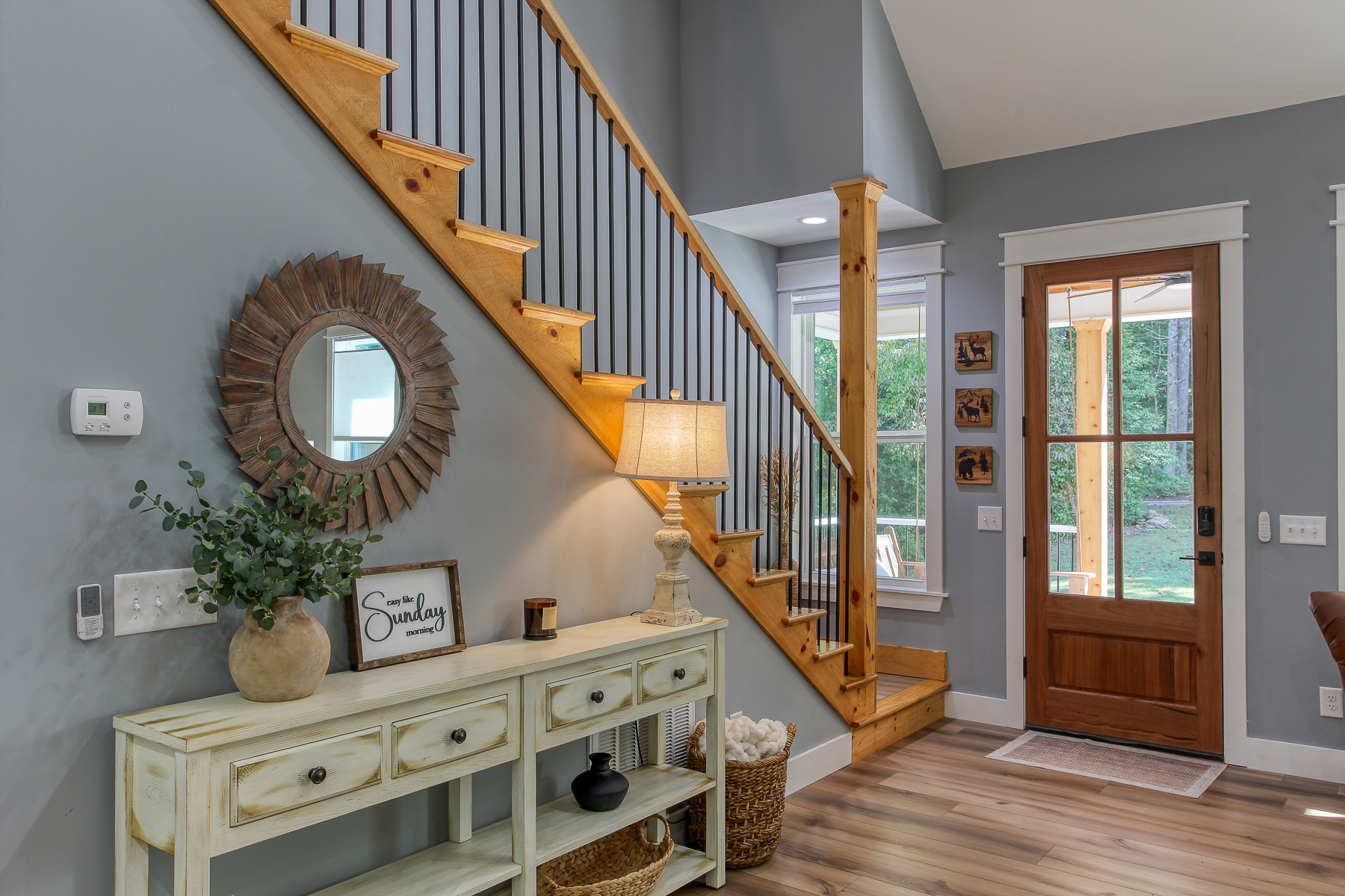 Warm wood accents and thoughtful touches welcome you inside Robbin’s Nest on Snowbird Creek, with stairs leading to the two upstairs queen bedrooms.