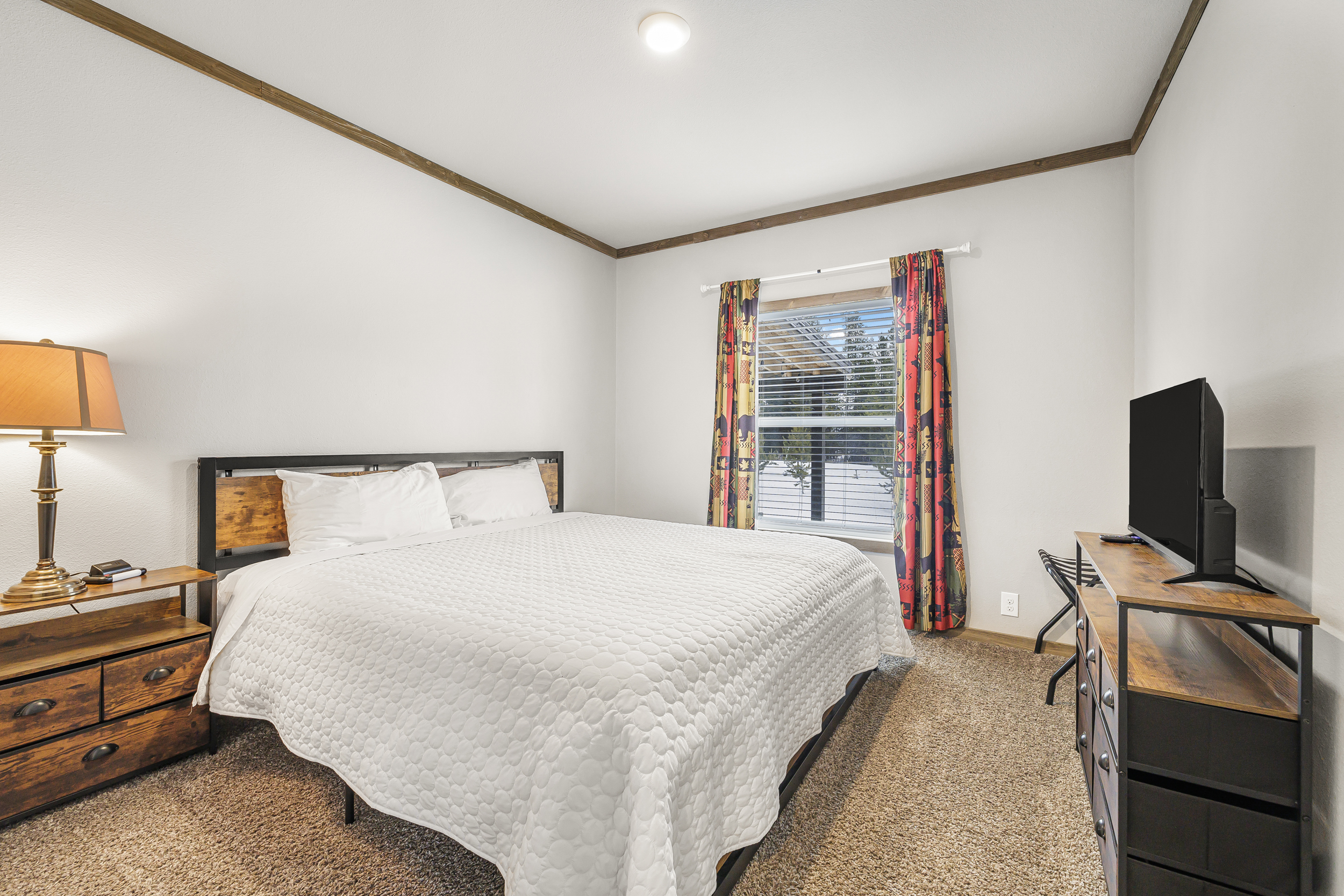 King bedroom 1 with TV for channel streaming