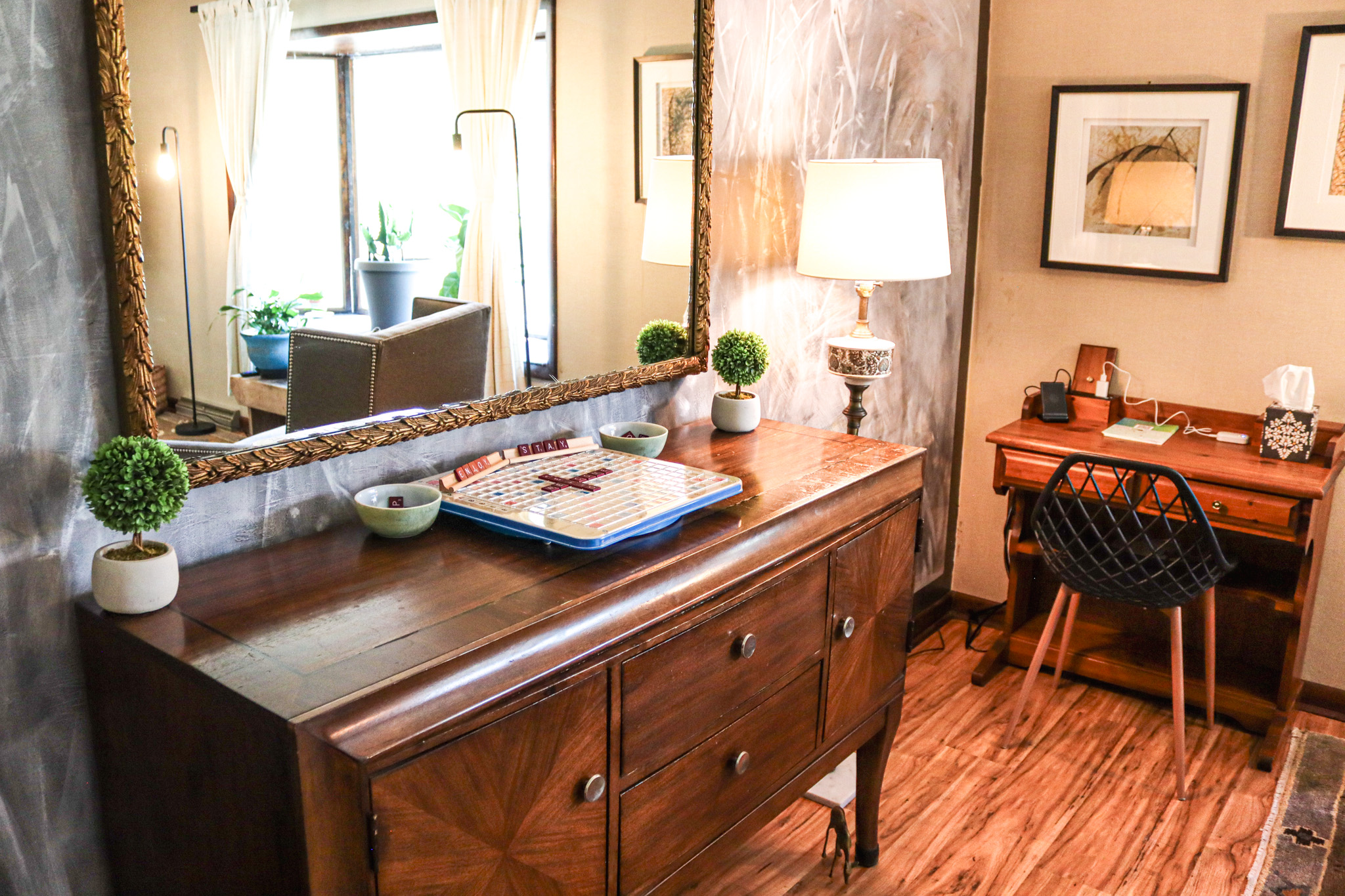 A charming buffet adds both character and convenience to the spacious living area plus a small desk work space