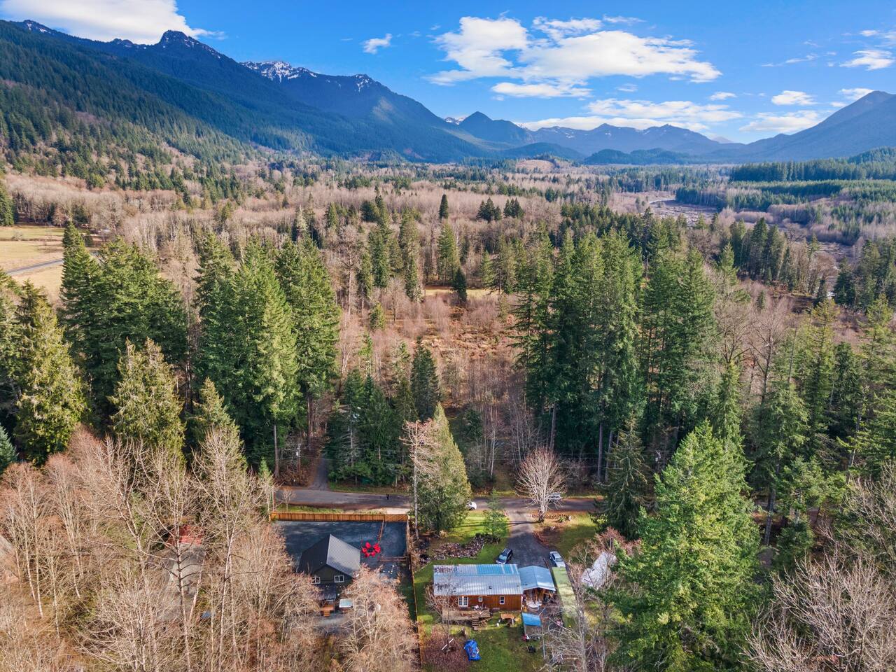 5 miles from the entrance to Mount Rainier National Park. Truly nestled in the woods