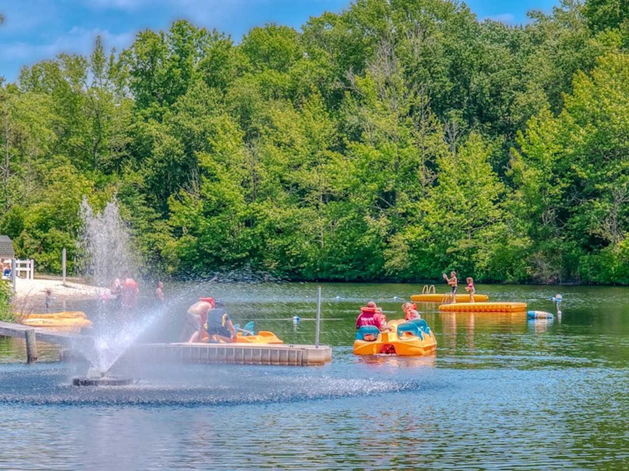 Swimming lake with kayak and paddle boat rentals