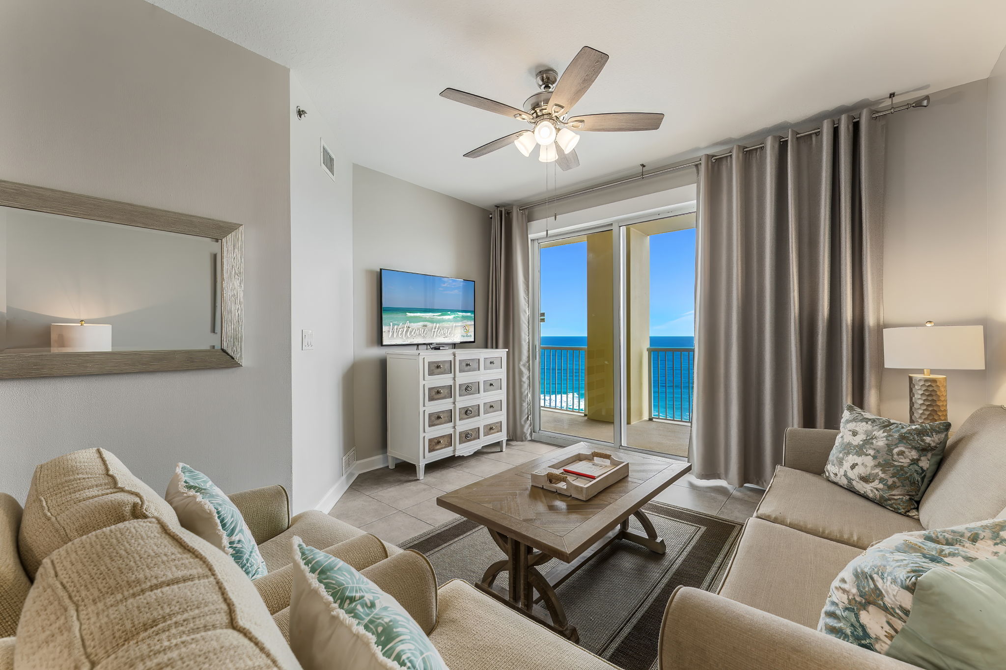 Smart TV, blackout curtains and plenty of storage in living room.