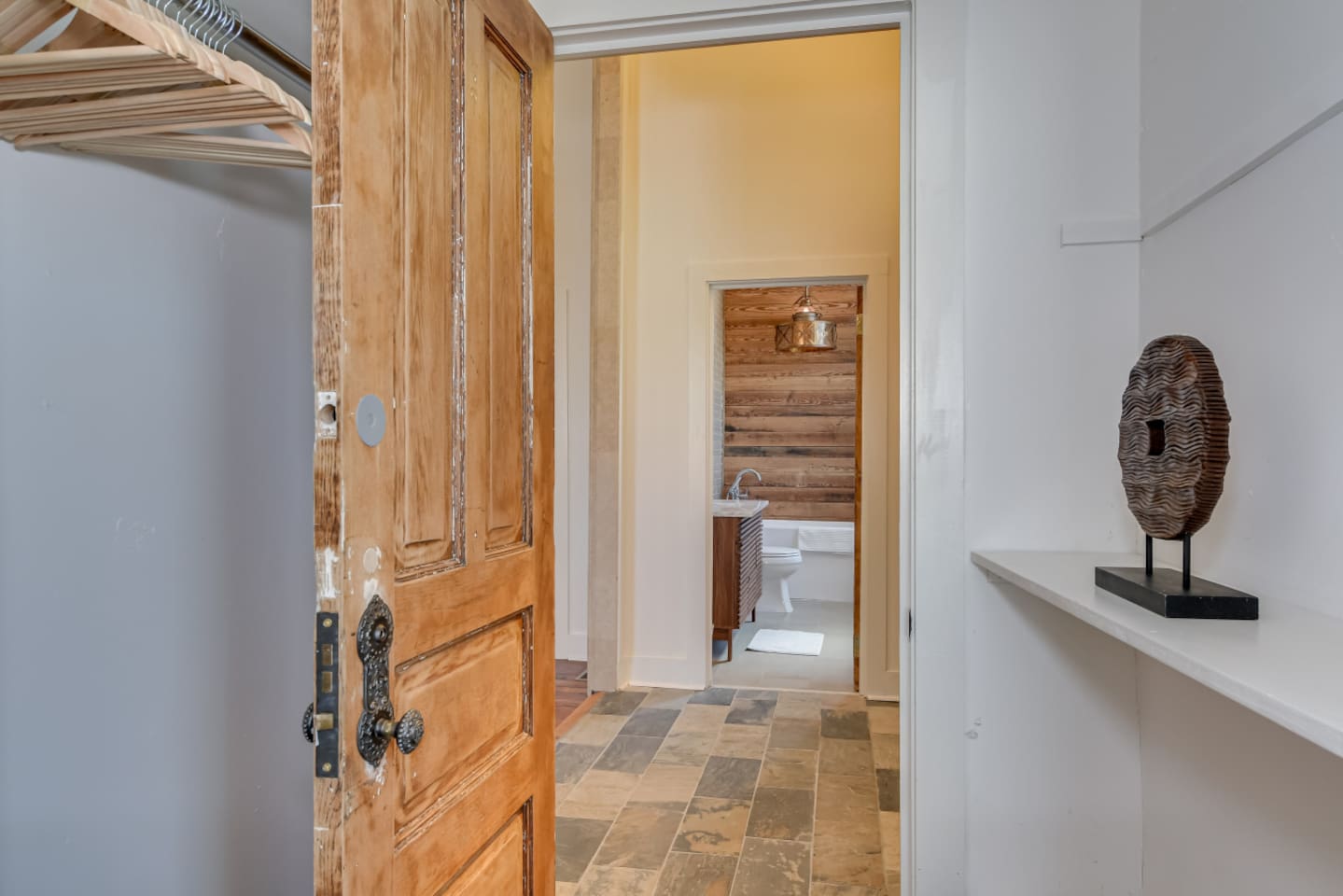 Hallway niche with stained modern-inspired décor.