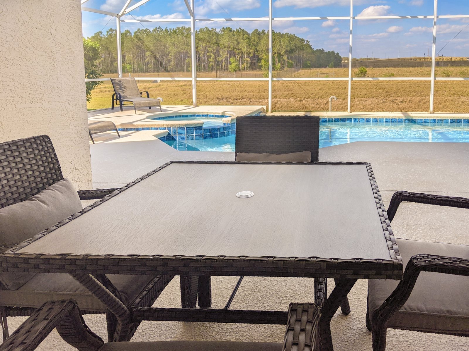 Poolside Dining area with a relaxing view.