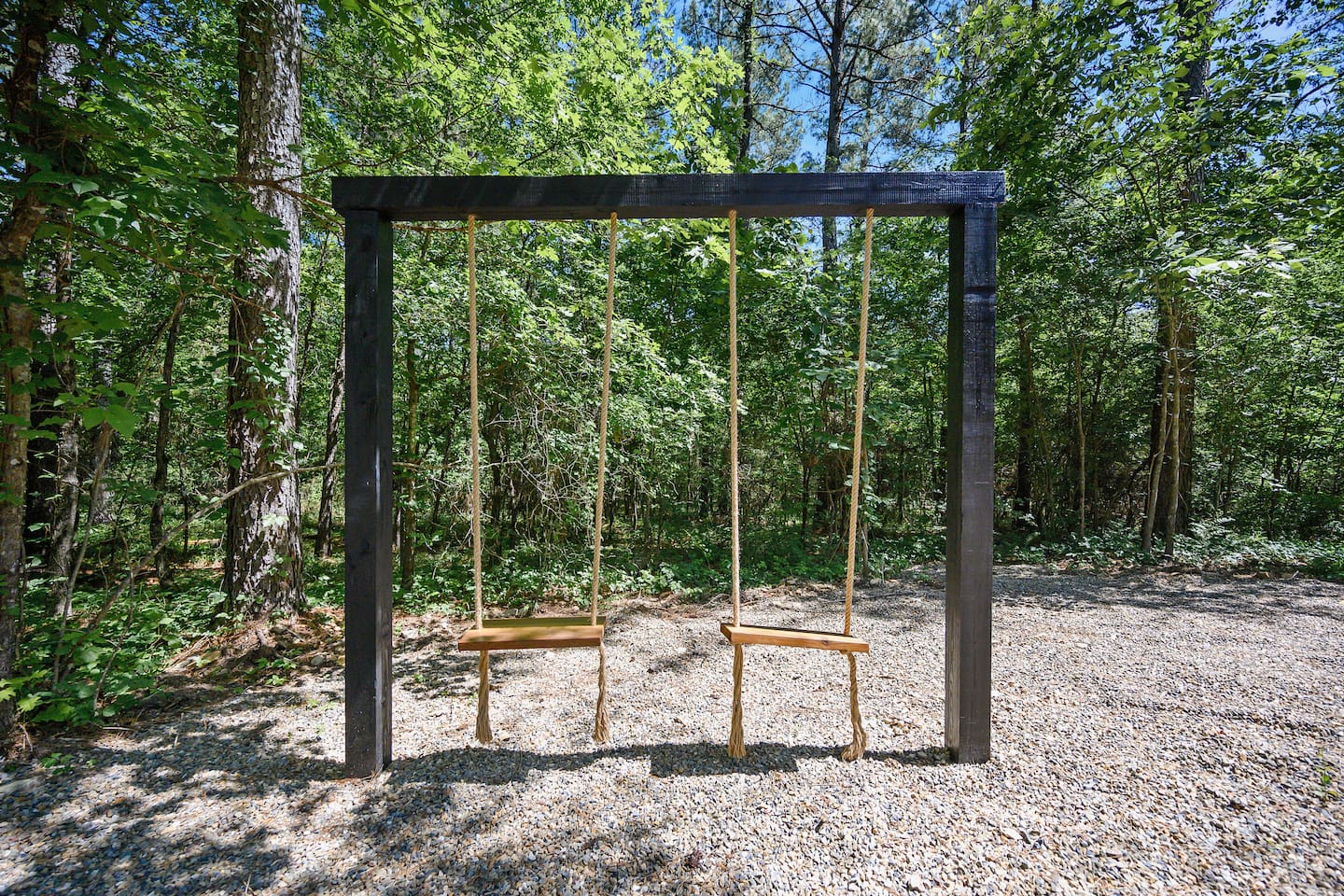 A perfect combination of comfort and outdoor charm—swing, relax, and watch the flames dance.