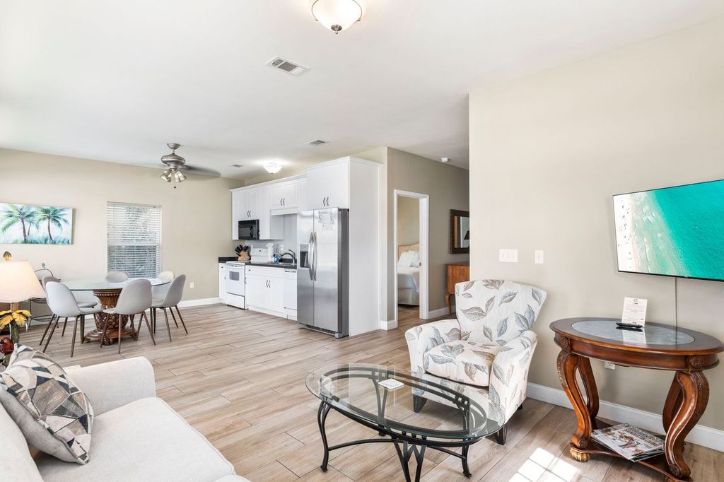 First Floor: Bright open-concept with a full kitchen, comfortable living area, and dining space.