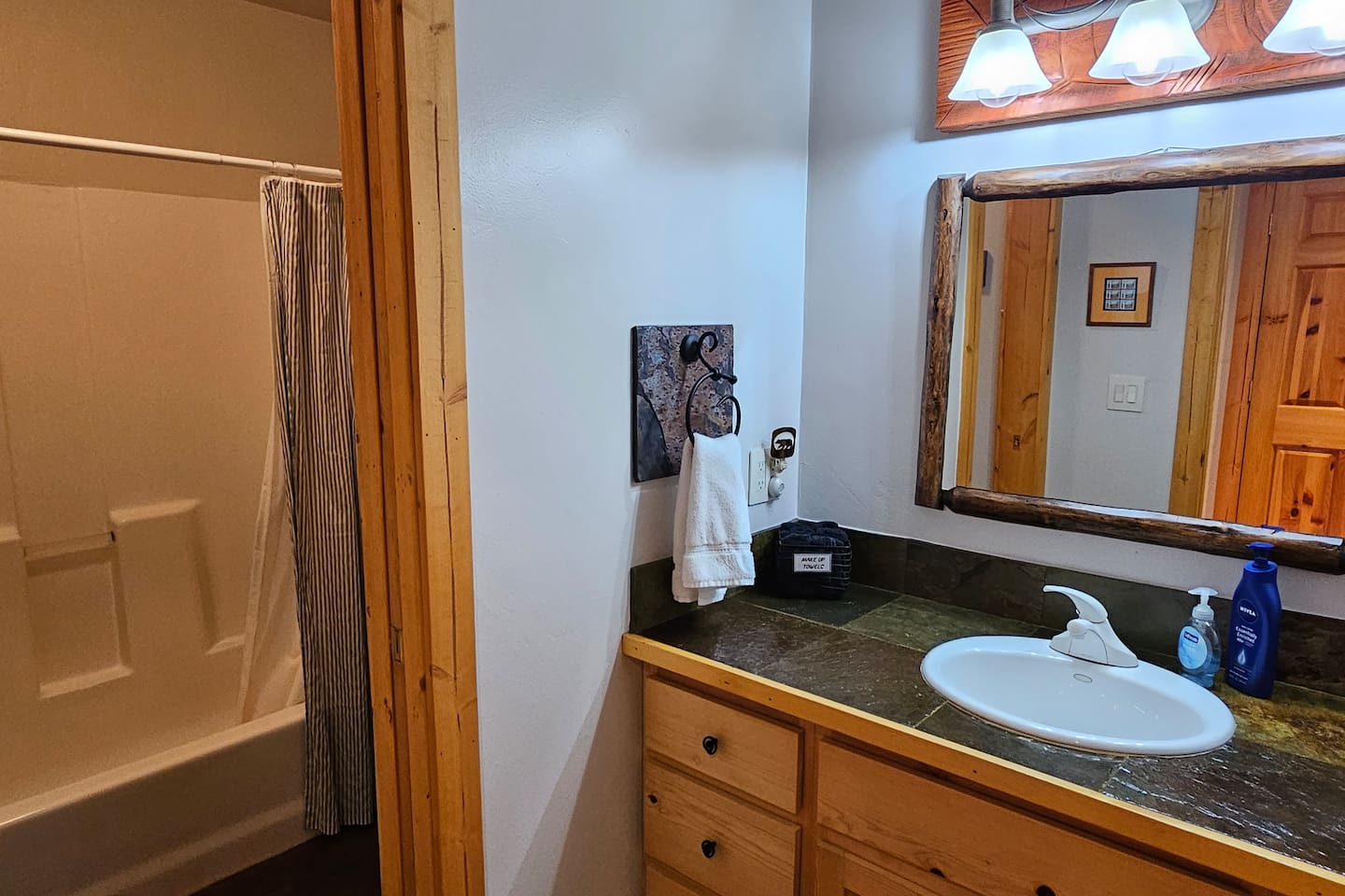 Bathroom 2 - separate sink and shower spaces, bathtub/shower combo.
