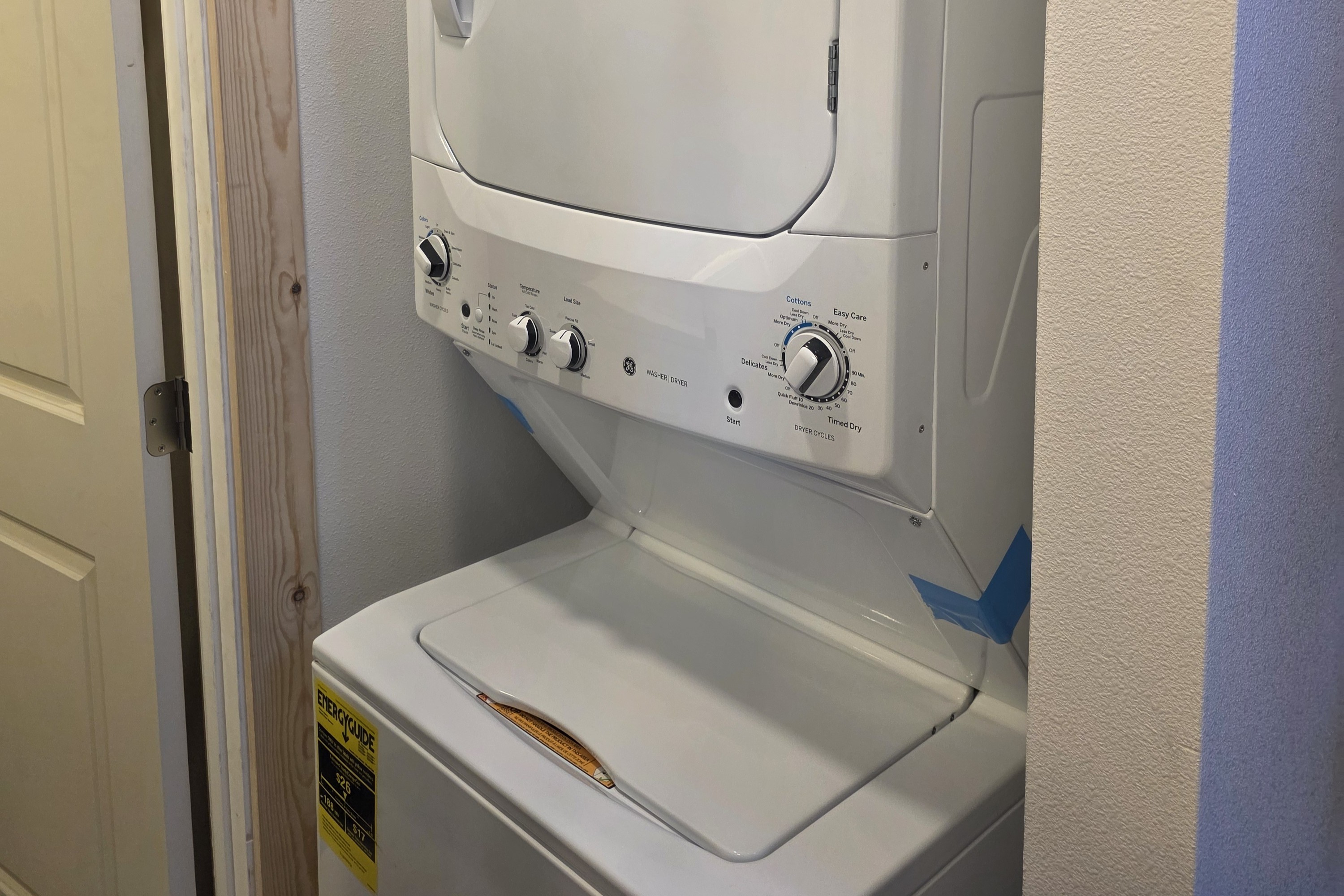 Washer/Dryer located just outside of the bathroom door.