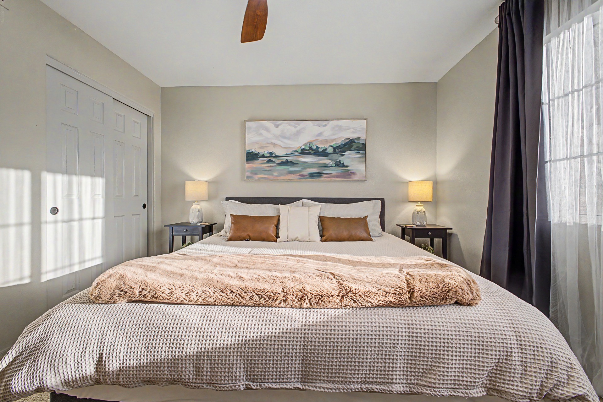 King bedroom 3 upstairs with 55" Smart TV, blackout curtains and ceiling fan