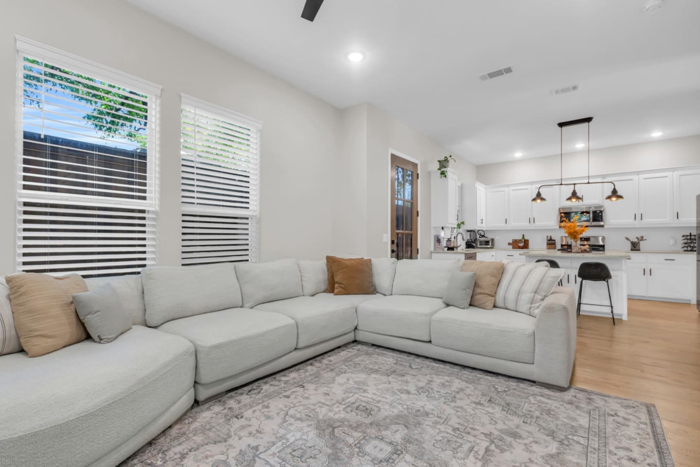 Open living space connecting seamlessly to dining and kitchen.