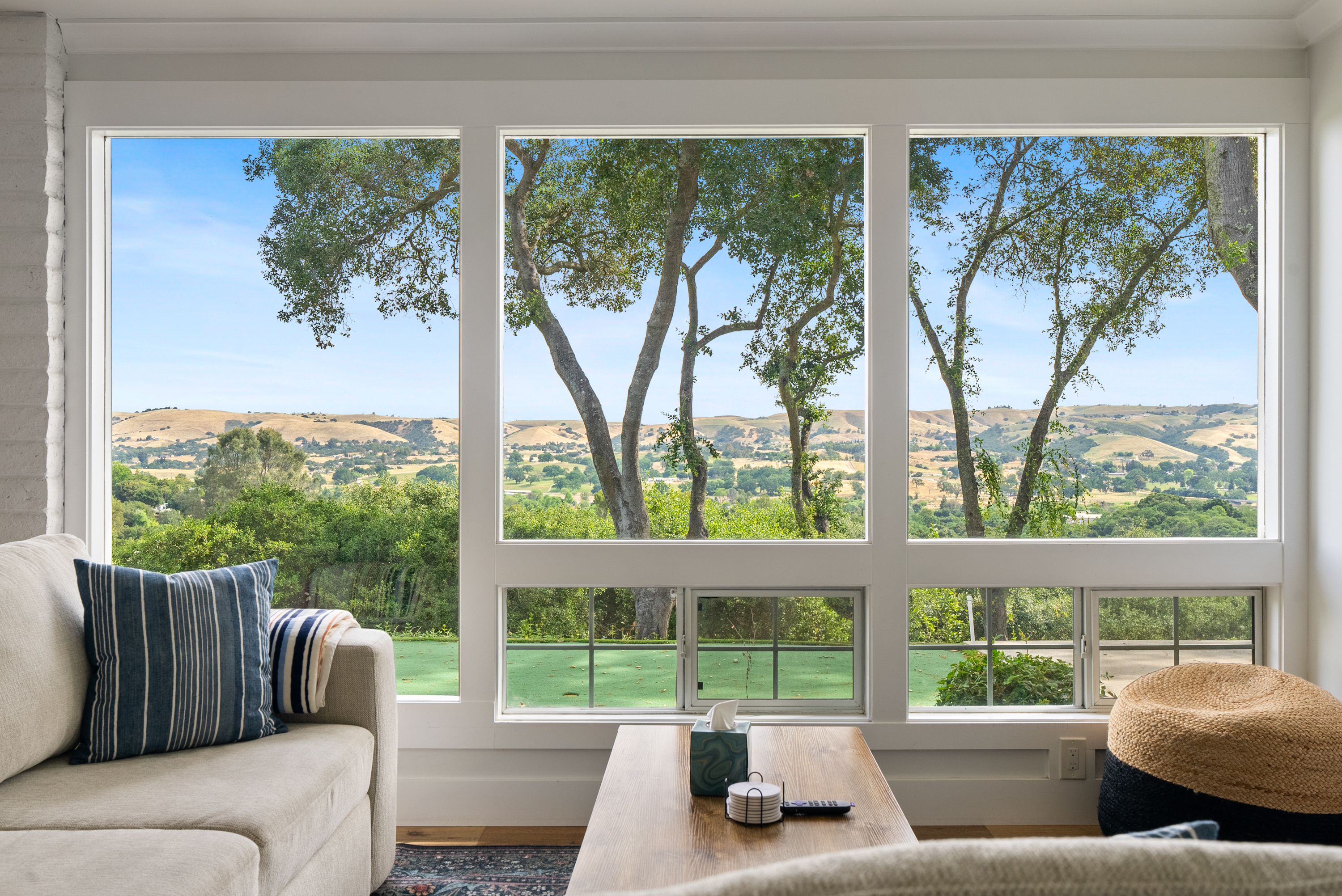 A sunlit lounge with sweeping views.