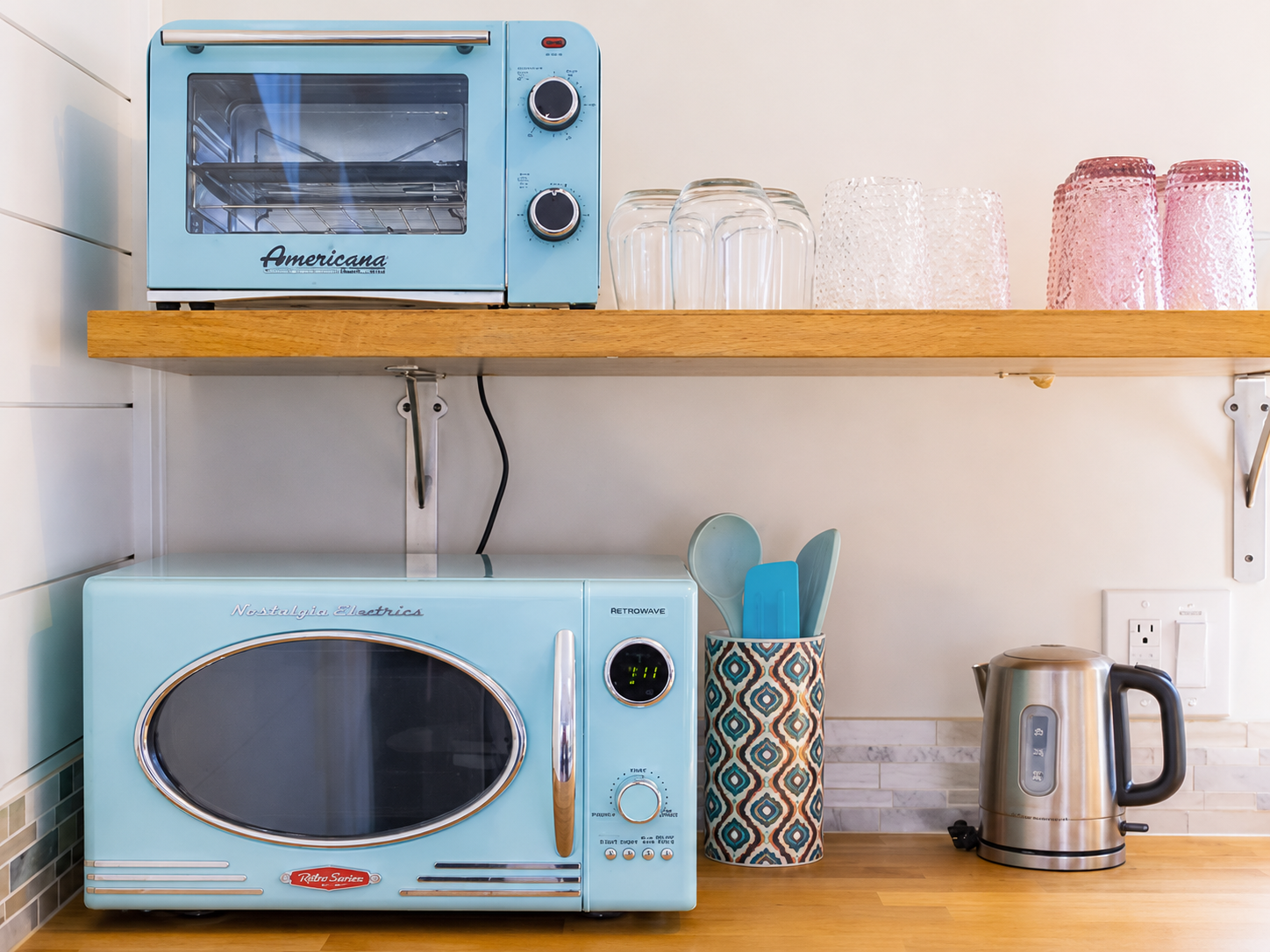 {Coffee & Tea Station} Retro-inspired coffee bar stocked with a kettle, microwave, toaster oven, and all the essentials for an easy start to your day.