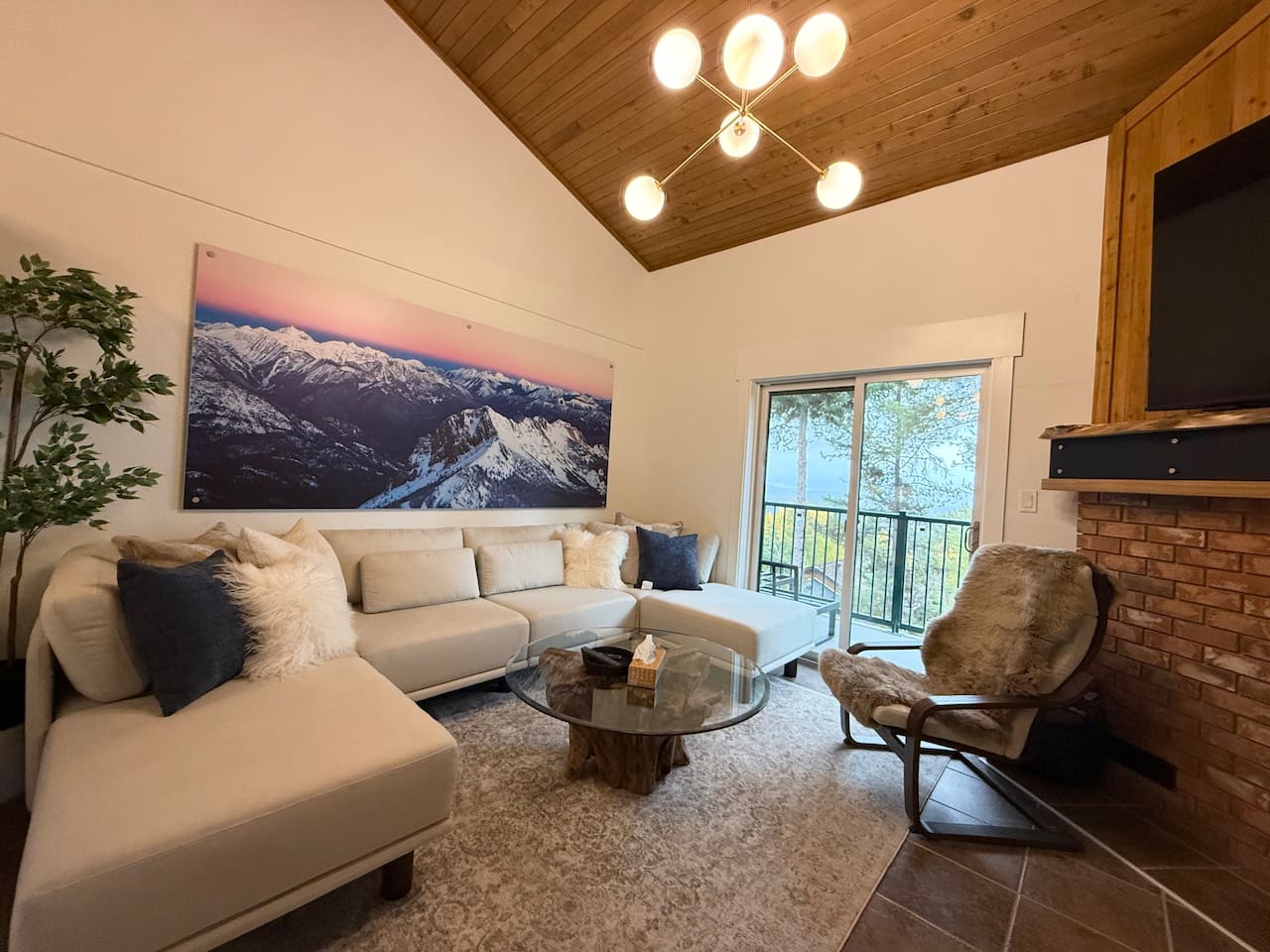 Balcony Access: The living room offers direct access to the private balcony, perfect for morning coffee while overlooking the stunning Rocky Mountains.
