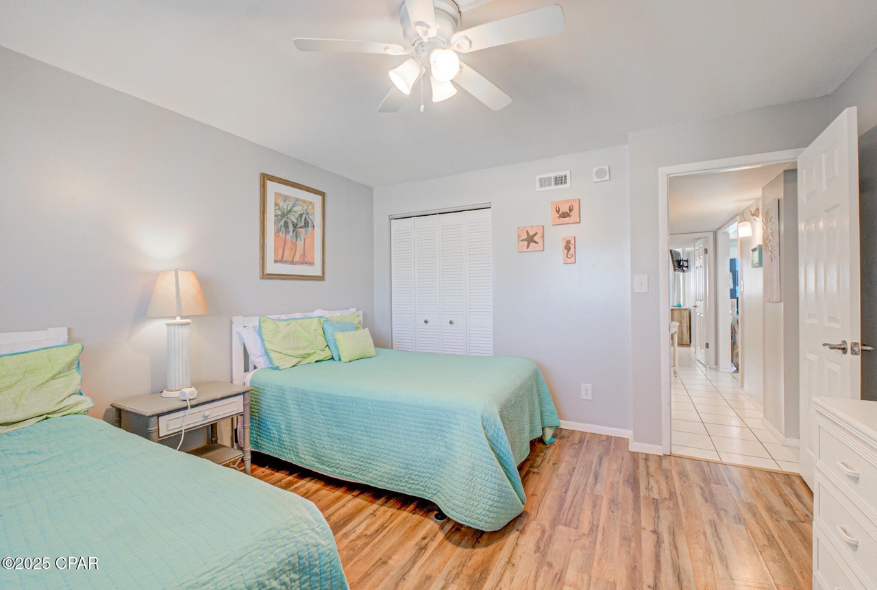 Guest Bedroom with 2 double beds, flat screen TV and dresser