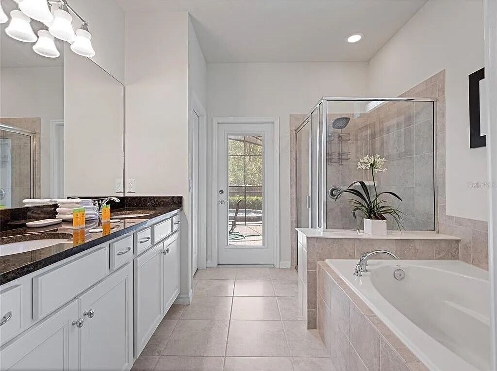Master bath w/double sinks, rain shower & separate stall for toilet with bidet