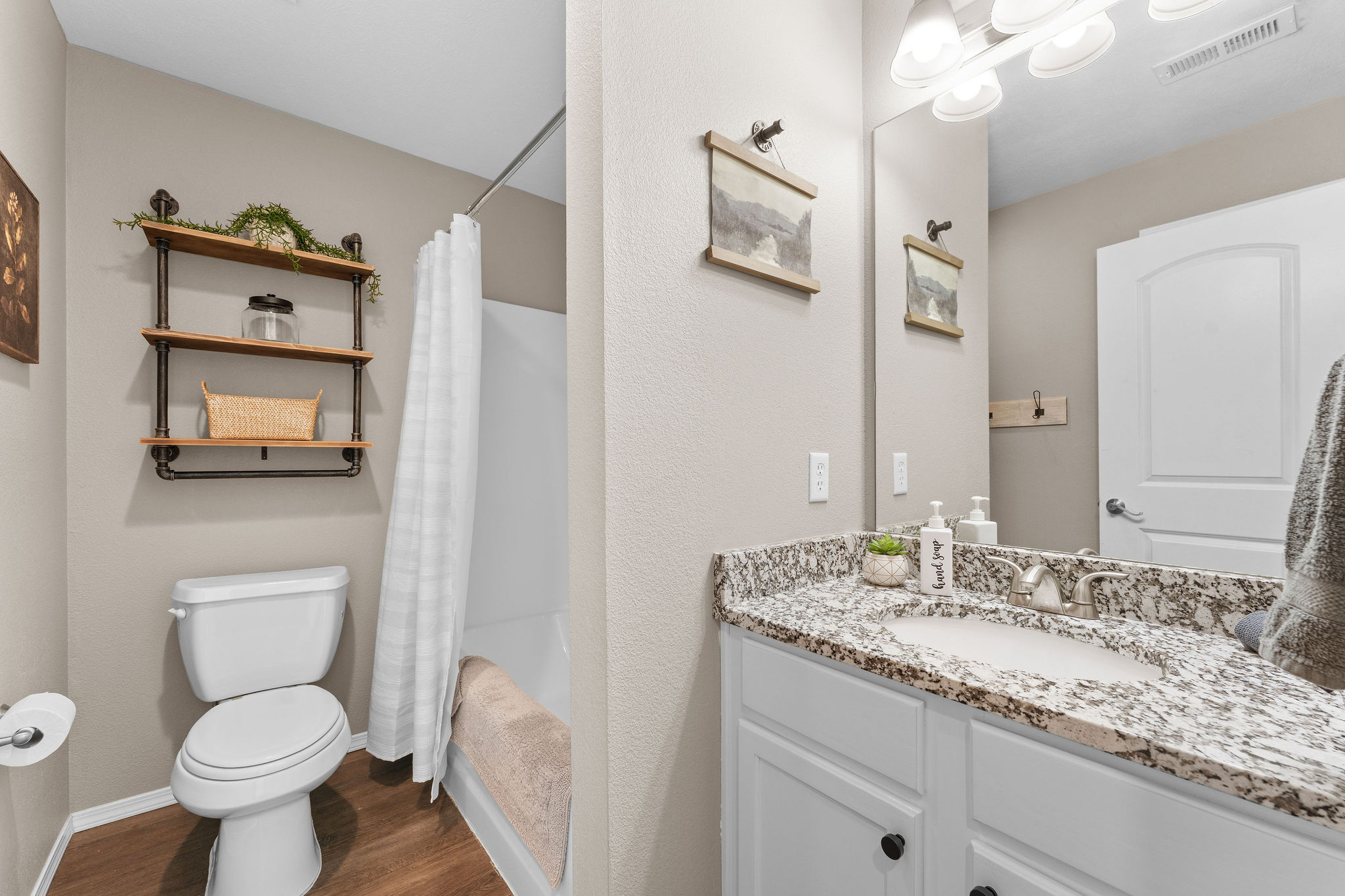 Second full bathroom with tub and shower.