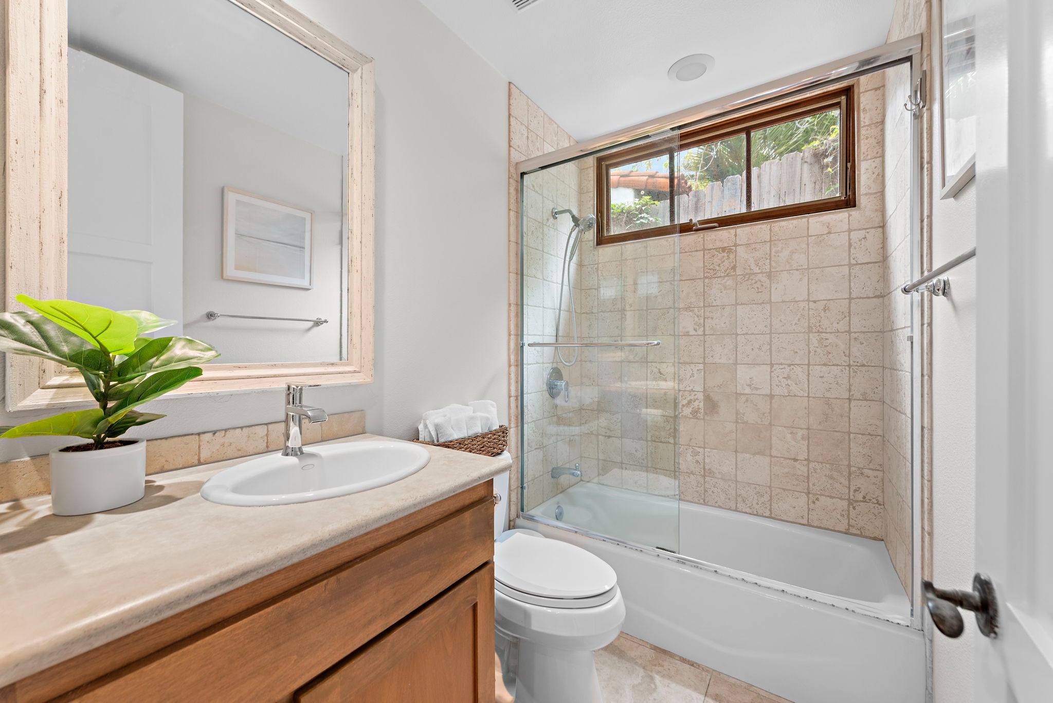 Our bright, clean hallway bathroom is also a full bathroom with a tub/shower and is fully equipped with soap, shampoo, and conditioner.