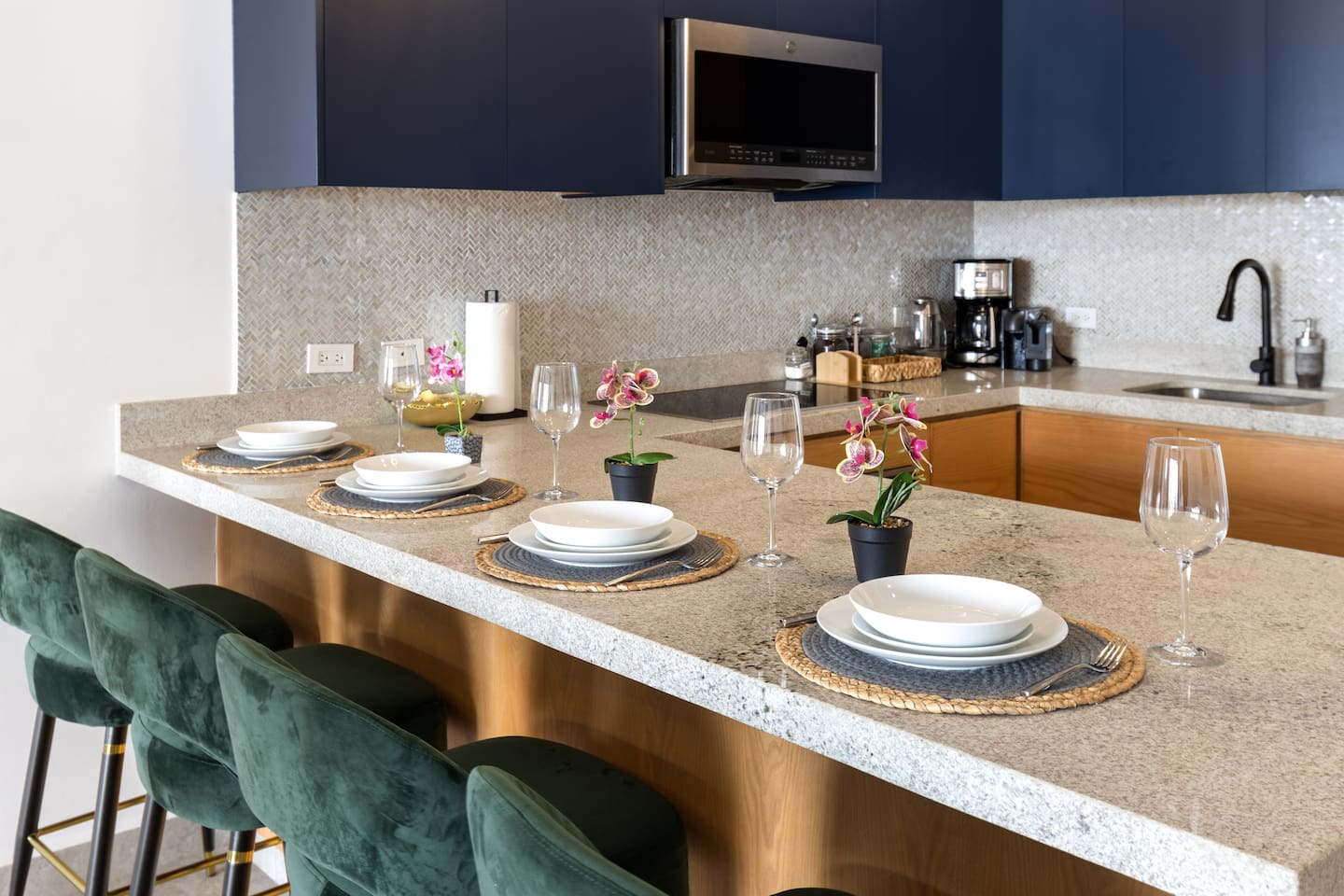 Enjoy a stylish kitchen counter eating setup, perfect for savoring meals and drinks with a modern Cabo vibe.