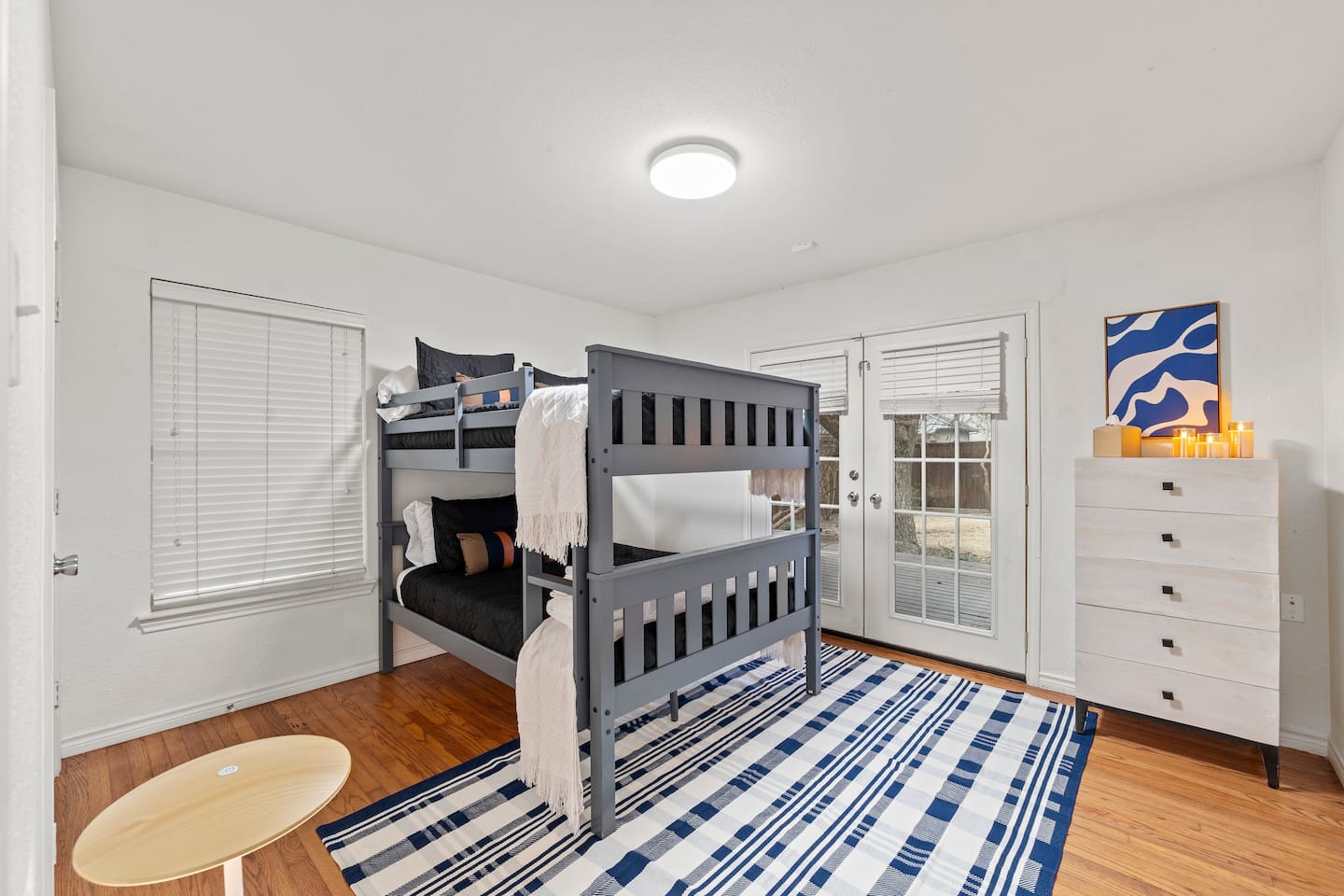 Two full sized bunk beds with cotton linens, and plenty of clothing storage make this a great oasis to rest in. There is direct access to the backyard with a child lock located at the top of the door.