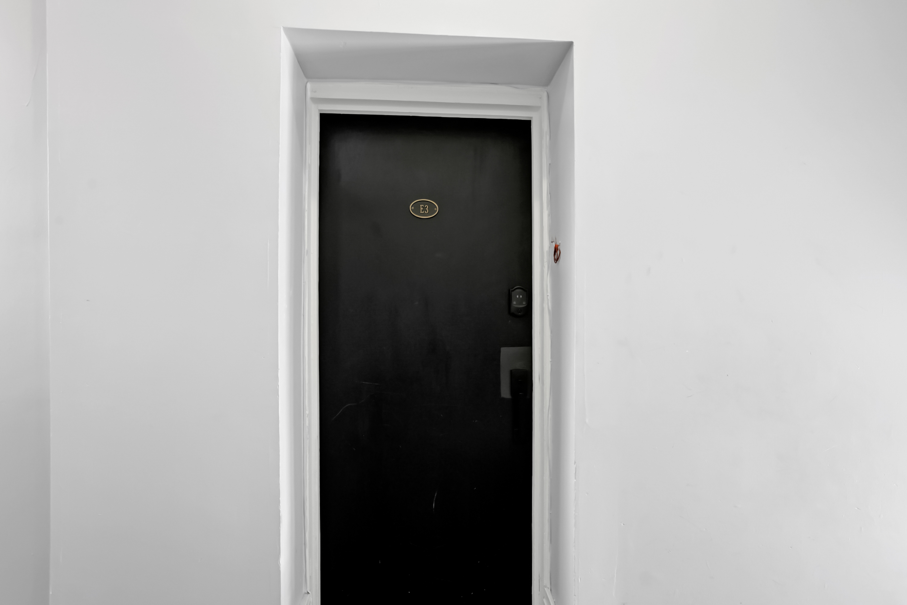 Black door marks your private entrance to Oak & Ivy Hideaway.