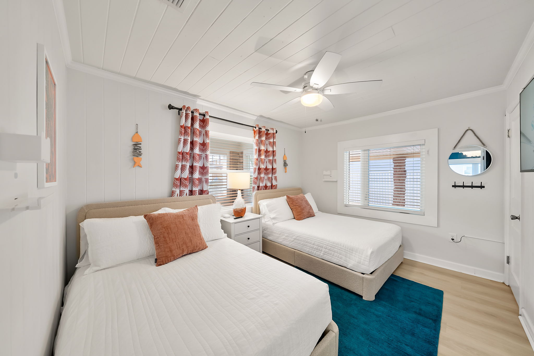Room for two (or 4) with two full beds, a ceiling fan, and coastal
curtains complete with a flat screen TV to stream movies. Ideal for
kids sharing a room or friends traveling together who need their own space.